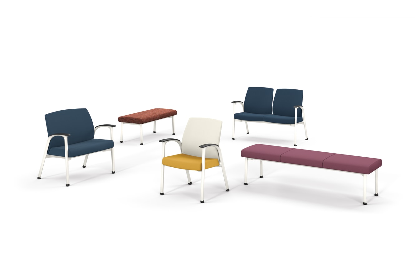 Modern seating arrangement featuring upholstered chairs and benches in blue, yellow, cream, maroon, and rust tones with metal frames