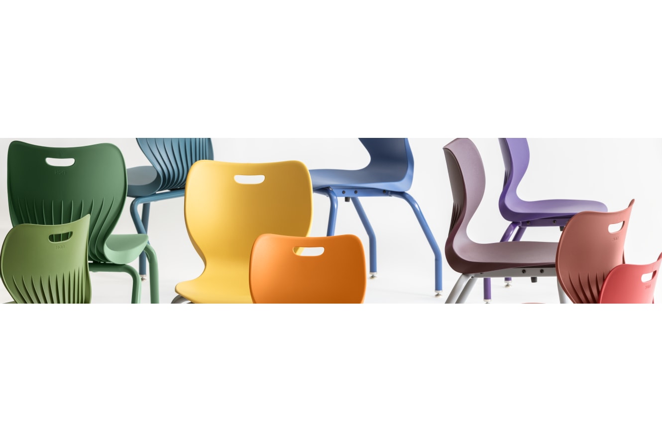 A collection of colorful, modern chairs in various shades of green, blue, yellow, and red, arranged against a plain white background.