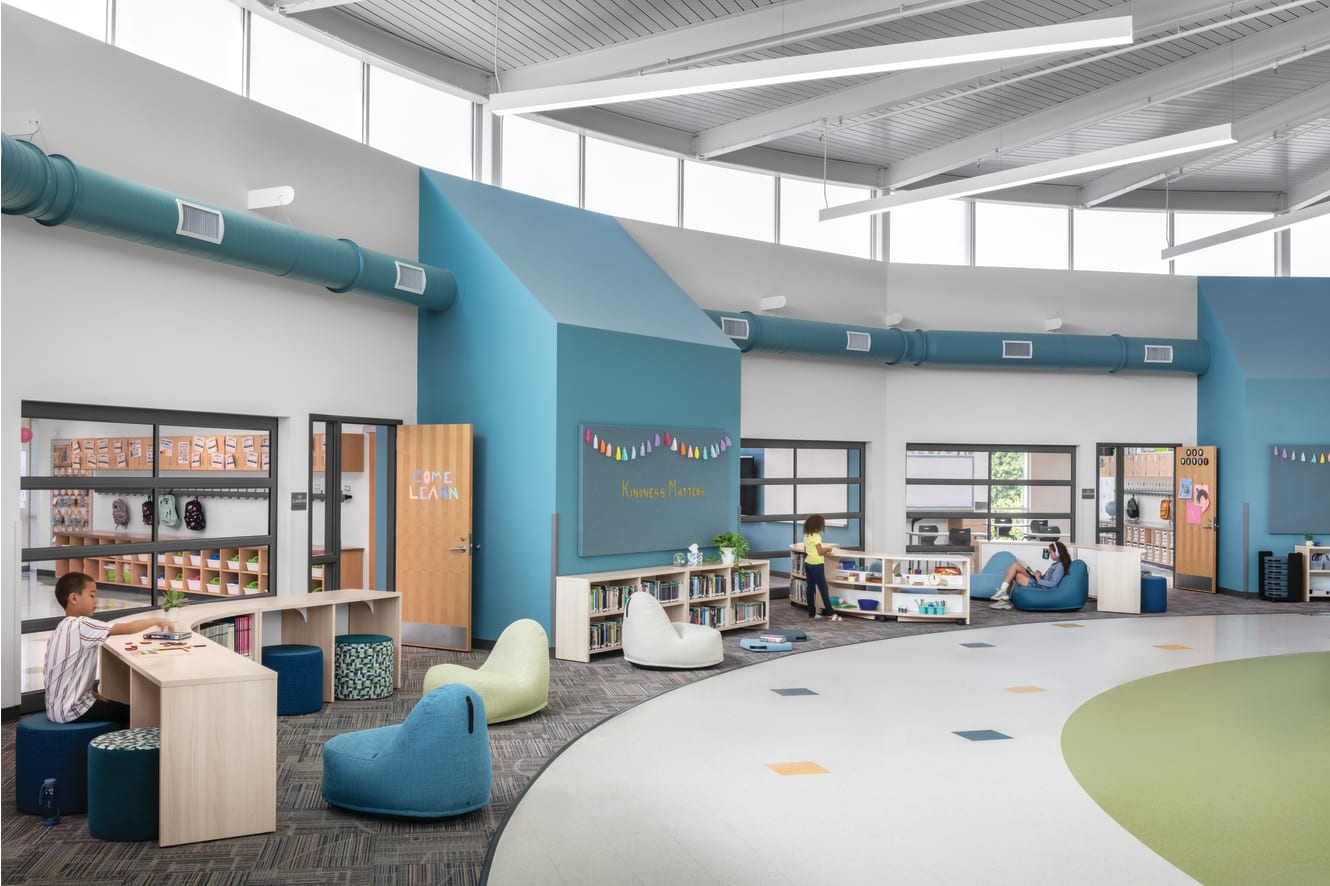 Storyline Bookcases and Bistro Tables with Confetti Floor Lounge and Flock Minis.