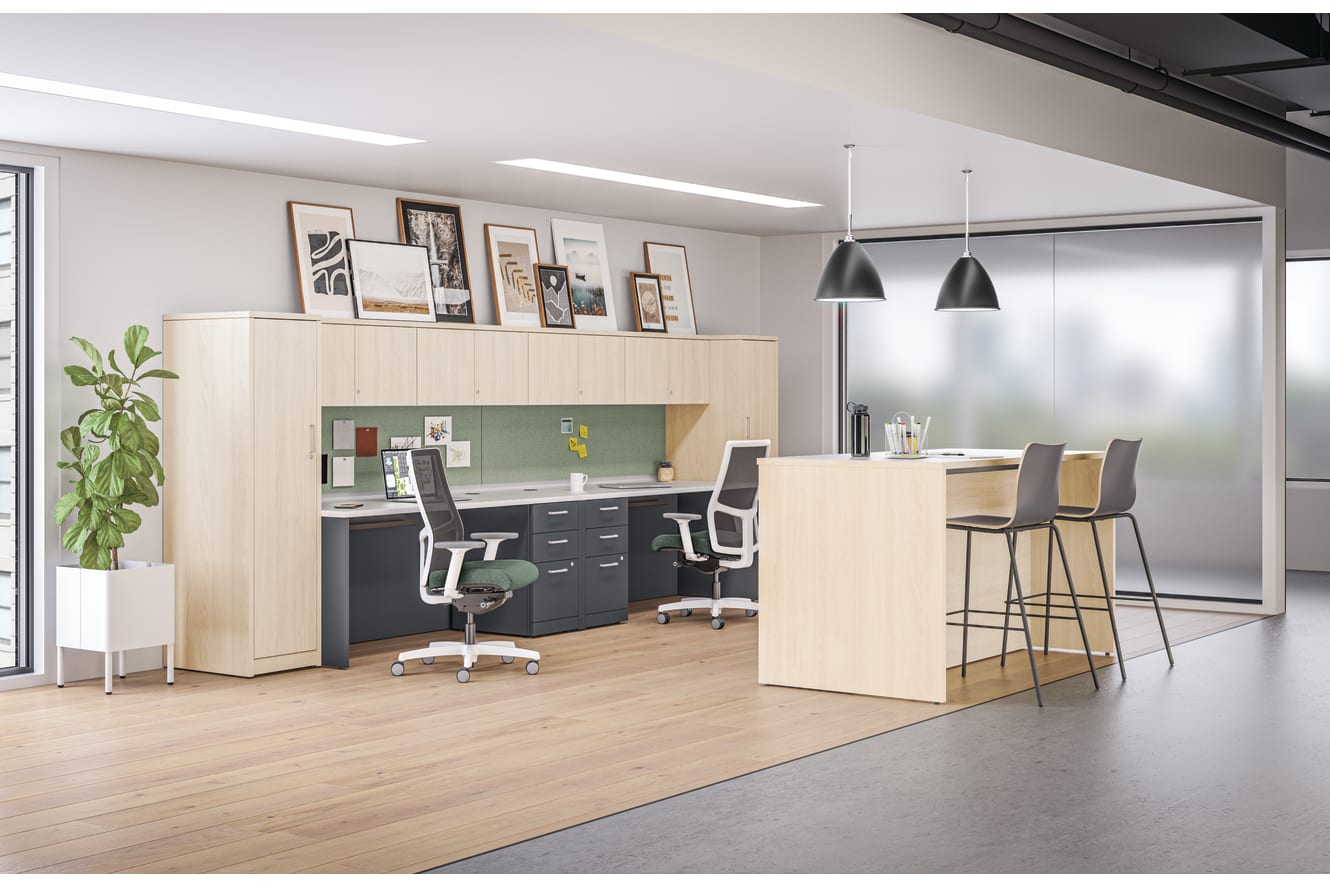 10500 Series desks with personal towers and overhead storage near Storage Island collaborative workspace.