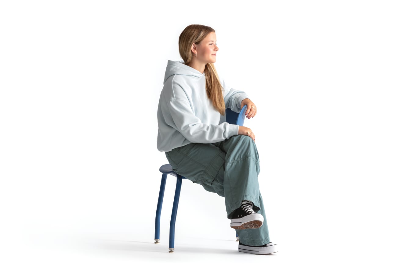 One seated student on a blue monotone Smartlink chair. One seated student on a blue monotone Smartlink chair. One seated student on a blue monotone Smartlink chair. One seated student on a blue monotone Smartlink chair. One seated student on a blue monoto
