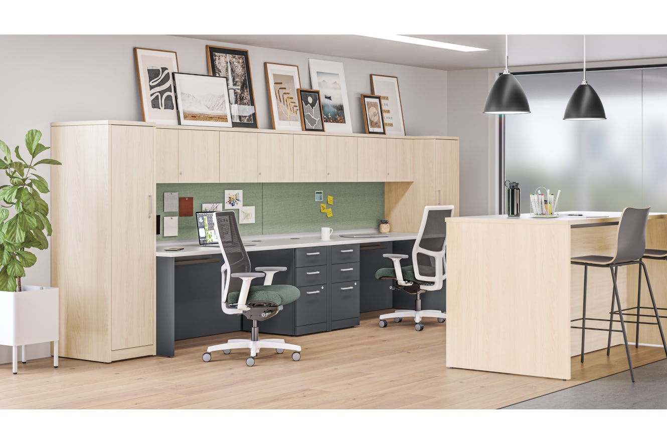 10500 Series desks with personal towers and overhead storage near Storage Island collaborative workspace.