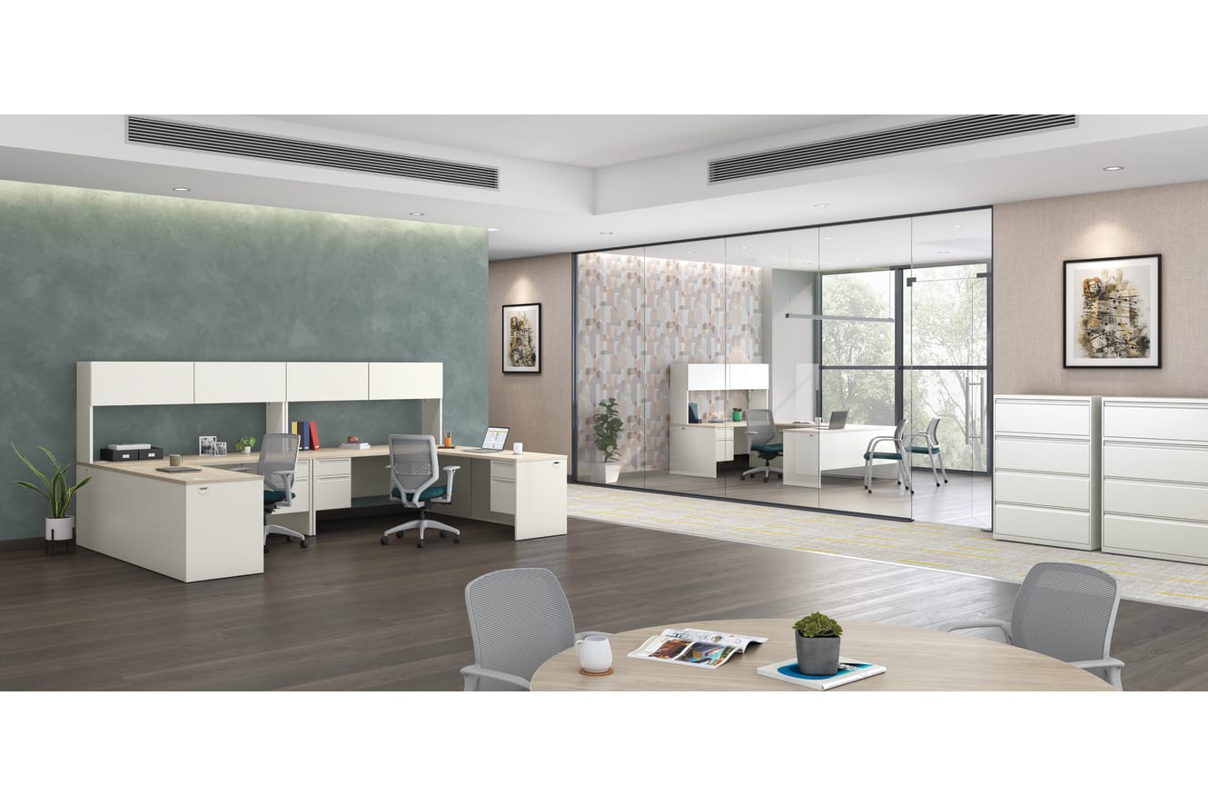 A modern and minimalist home office space with a white desk, shelves, and a large mirror on the wall, set against a backdrop of neutral-toned walls and floors.