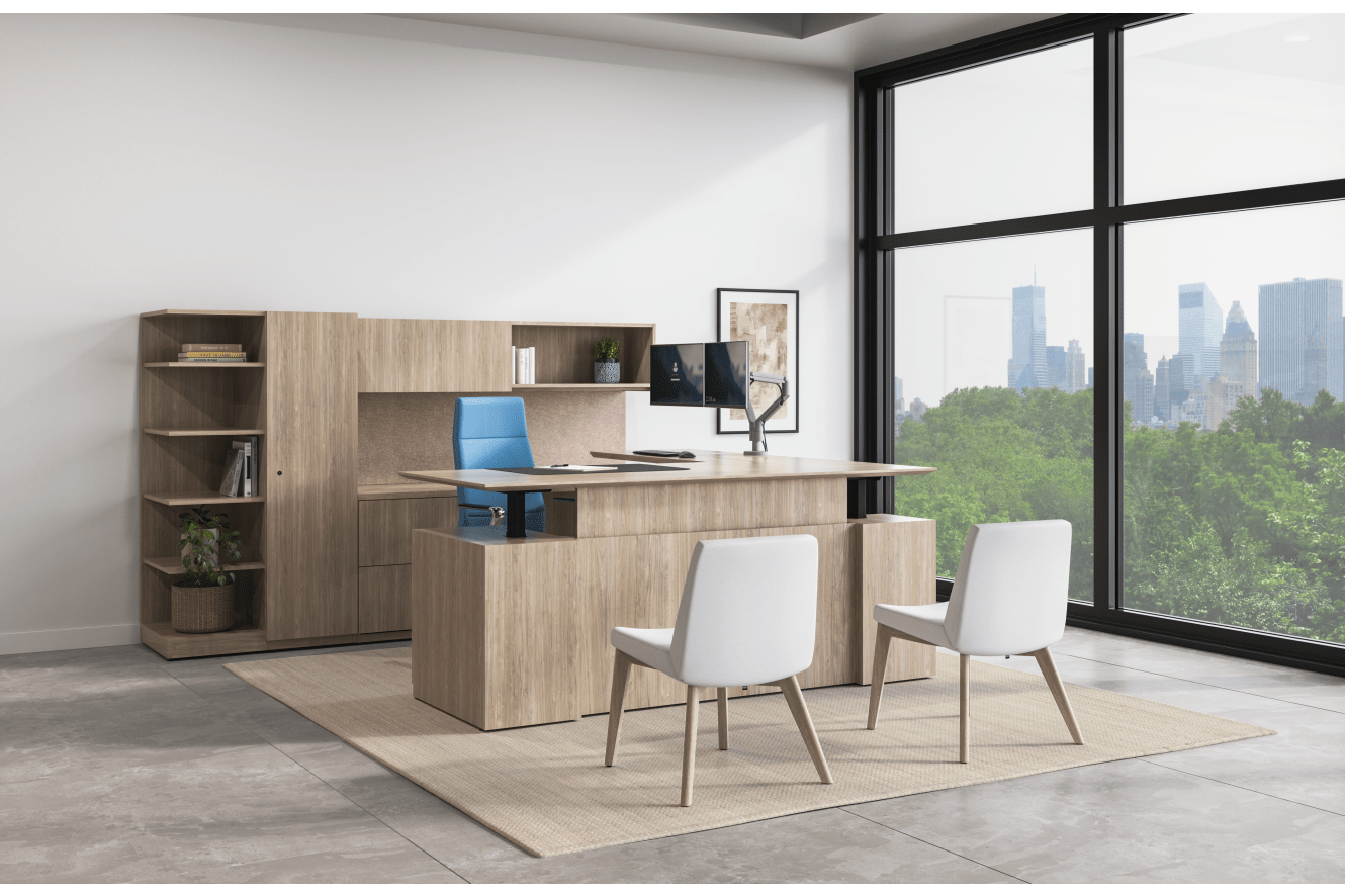 Concinnity Height-Adjustable L Desk in light laminate with flock guest chairs in light fabric in a private office with a wall of windows.