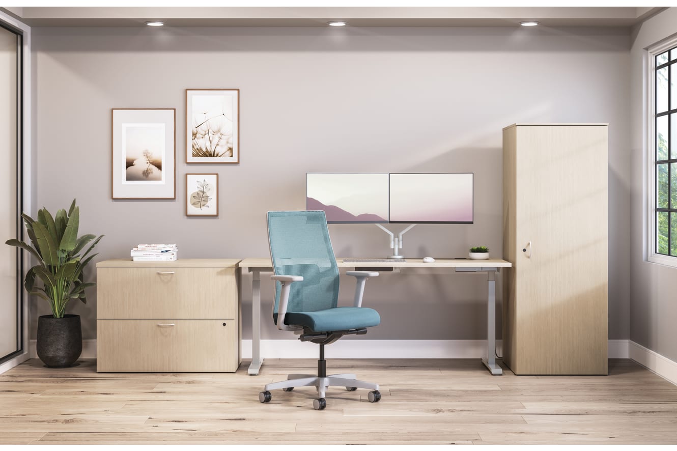 Private office featuring Mod desk with height adjustable table and Ignition task seating in blue fabric.
