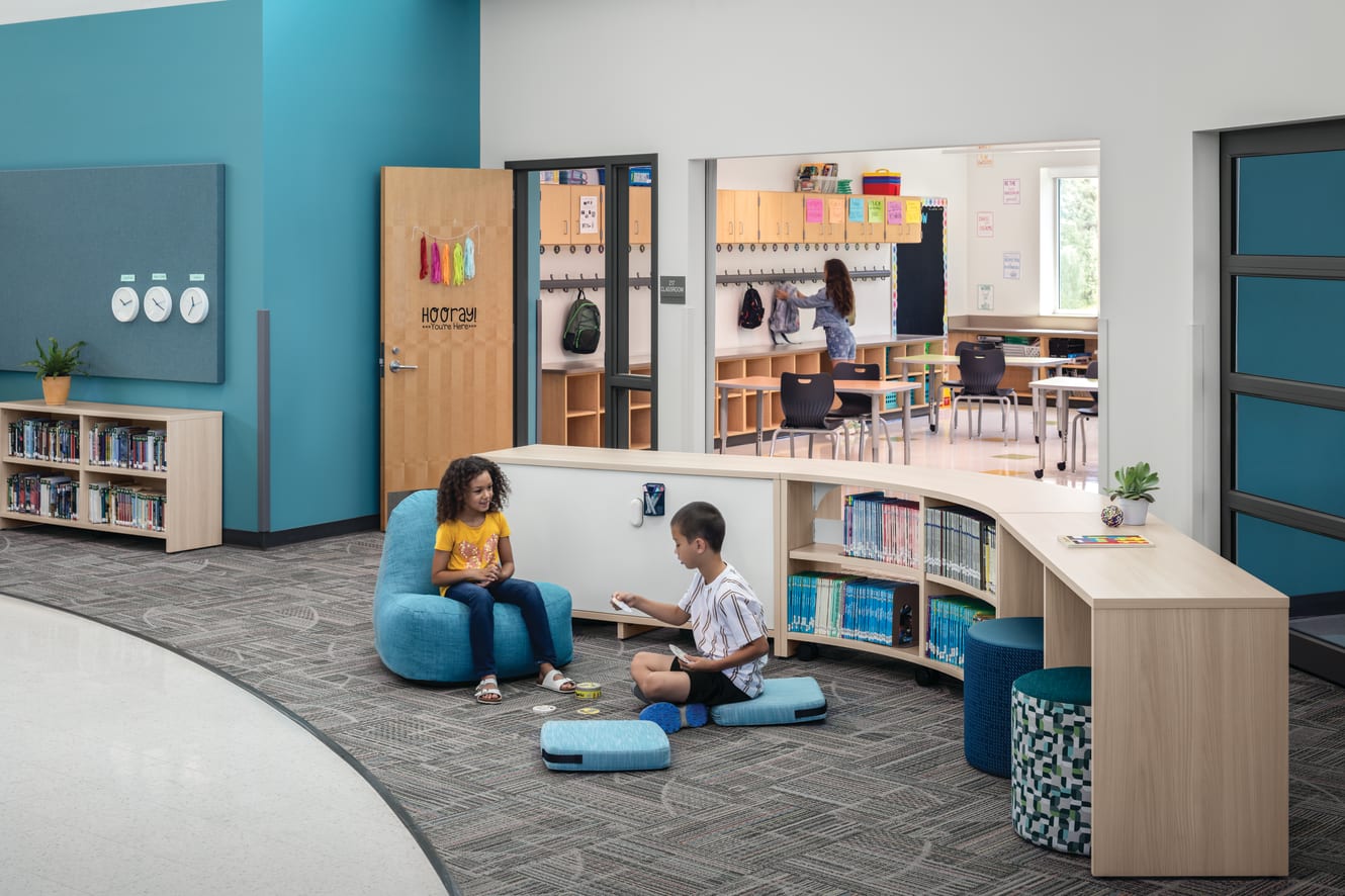 Storyline Bookcases and Bistro Tables with Confetti Floor Cushions and Lounge and Flock Minis.