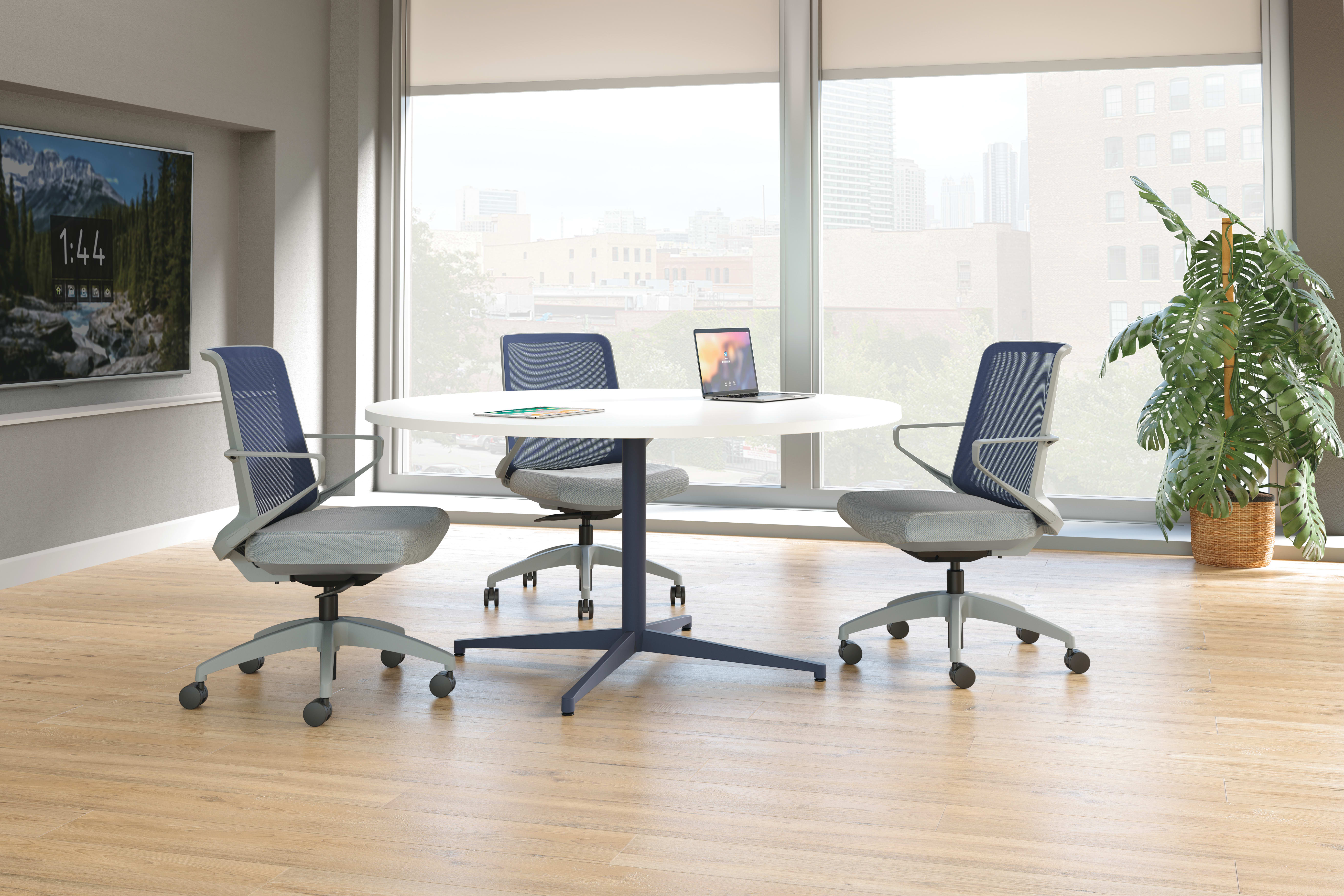 Cliq chairs with Preside round conference table.