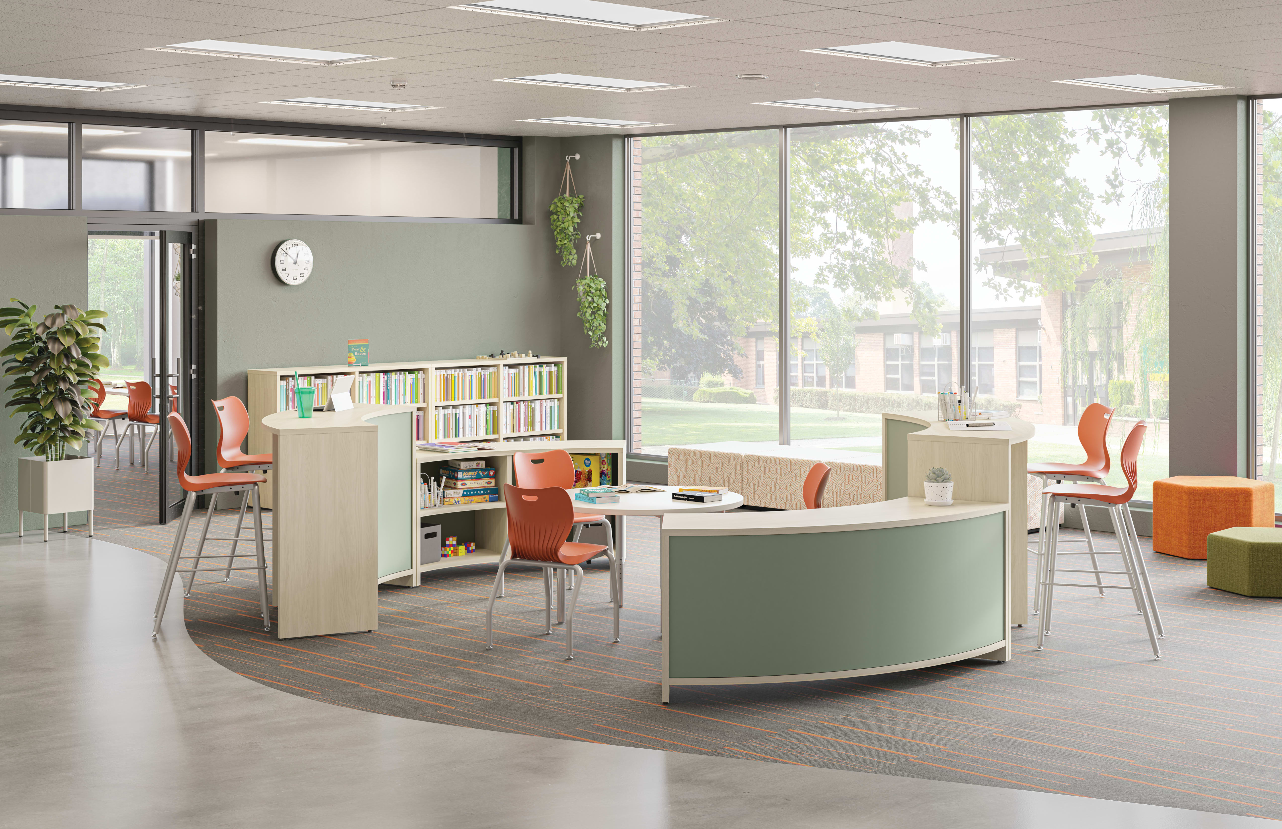 Open space outside of a classroom featuring Storyline bookcases and Build tables as a place for students to study.
