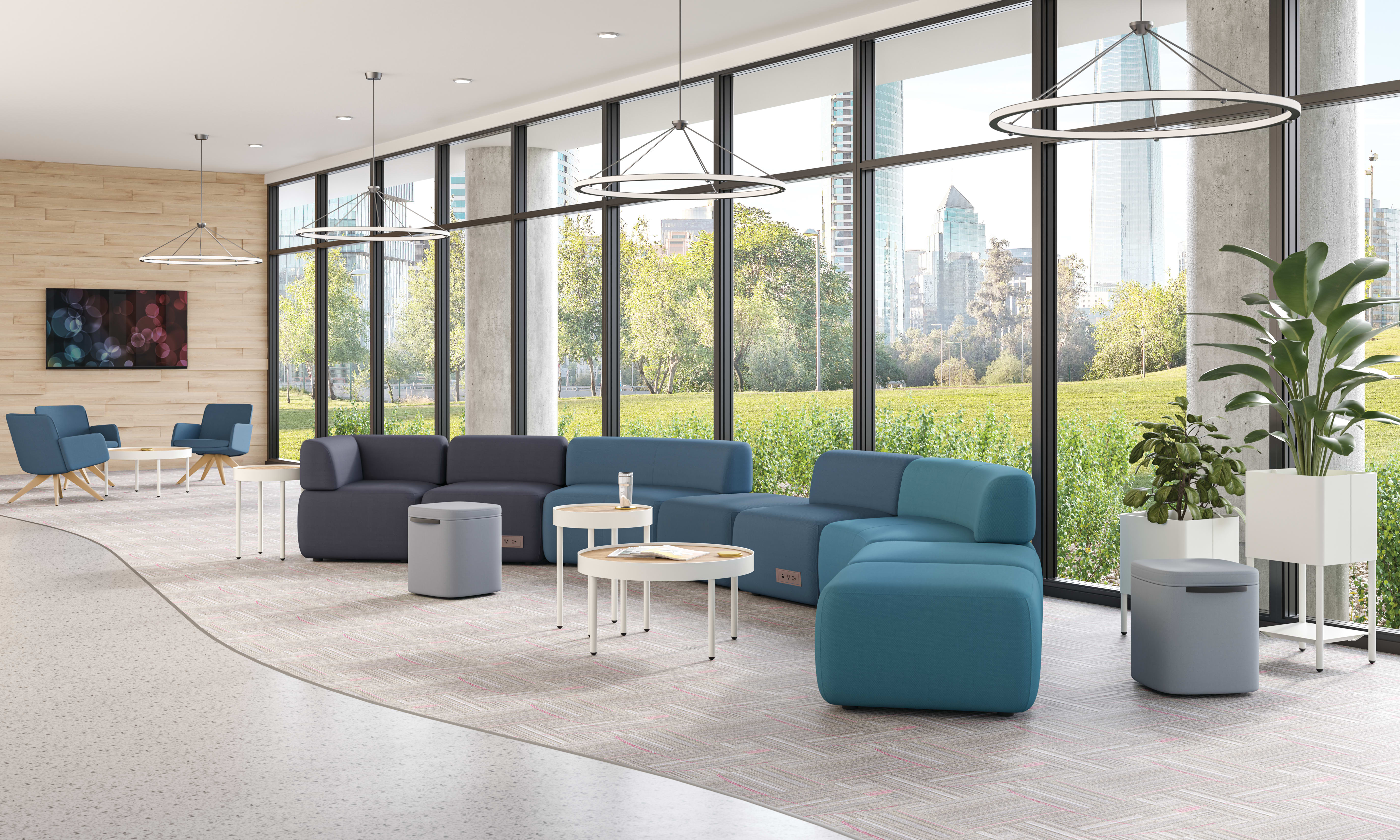 SoCo modular lounge in public space with Sculpt occasional tables & planters and Astir poufs.