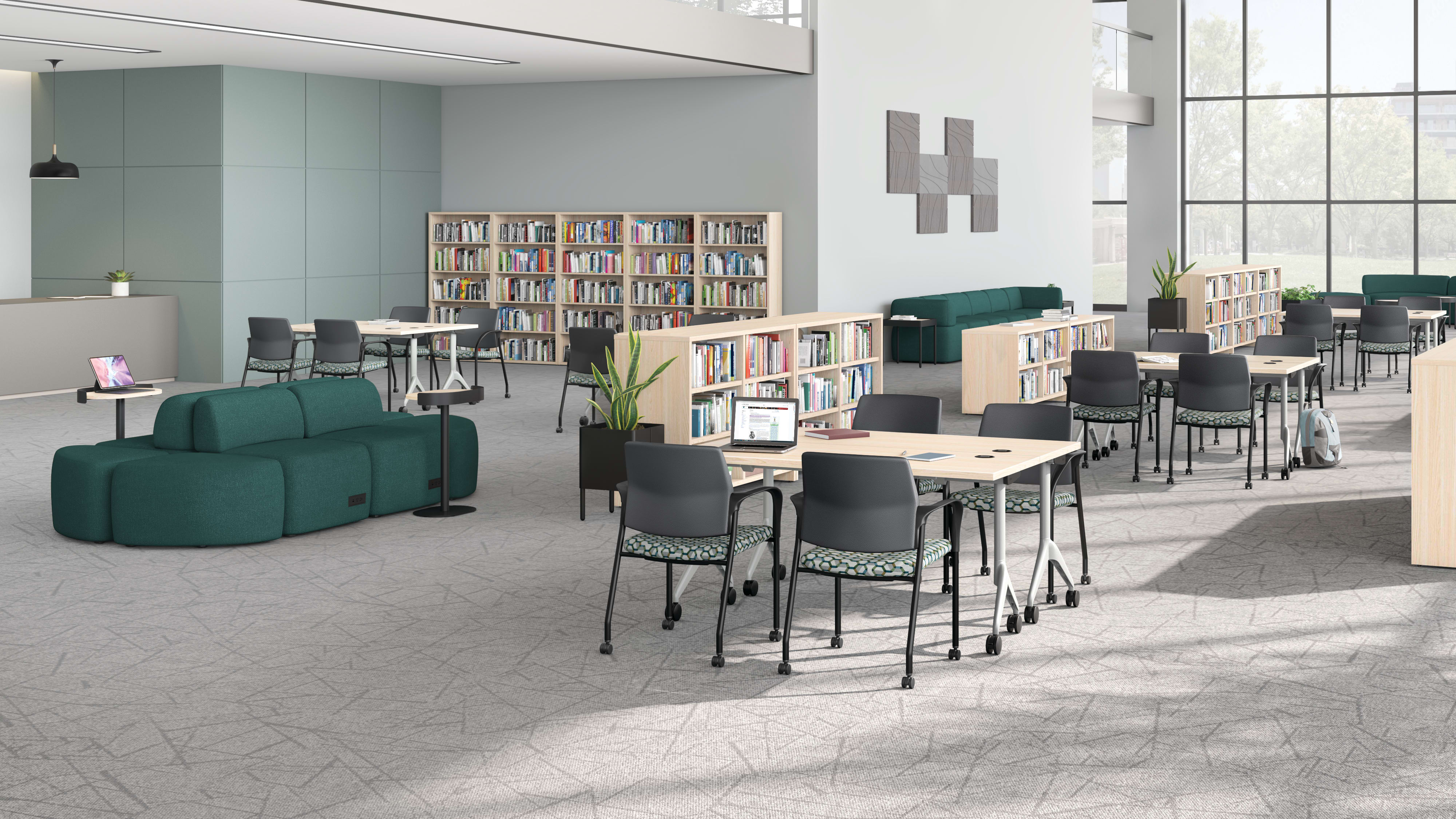 A multi-media center setting featuring SoCo seating, Ignition guest chairs, and Motivate tables.