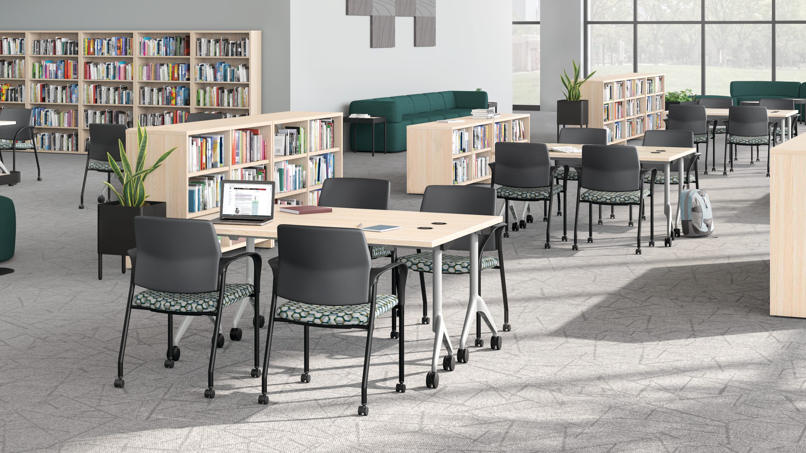 A multi-media center setting featuring SoCo seating, Ignition guest chairs, and Motivate tables.