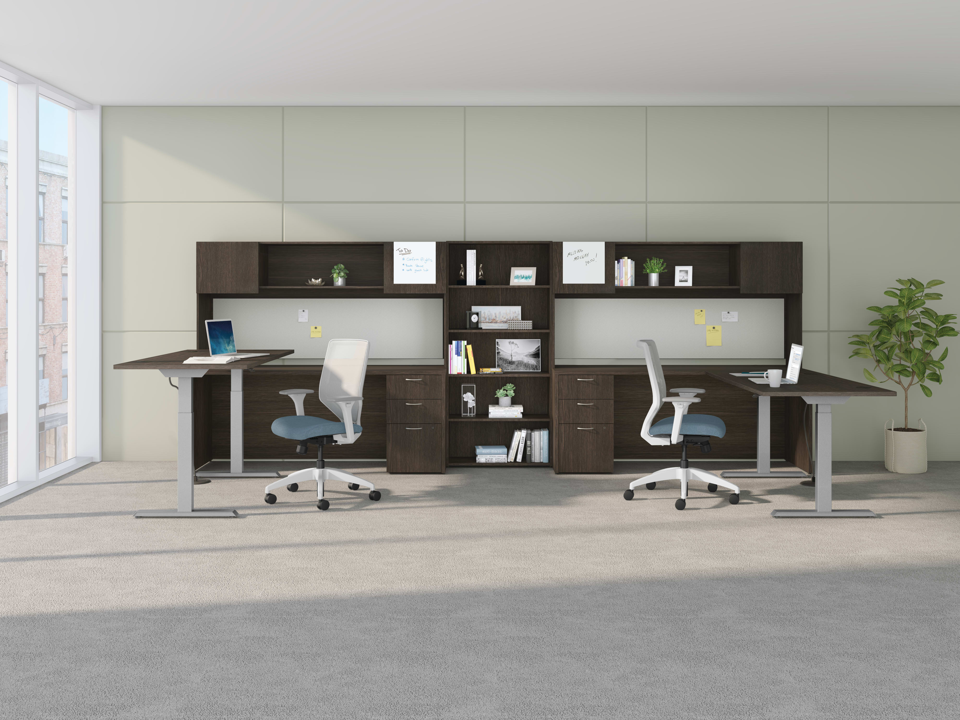 A shared workspace featuring Mod height-adjustable desks and storage components with Solve task seating.