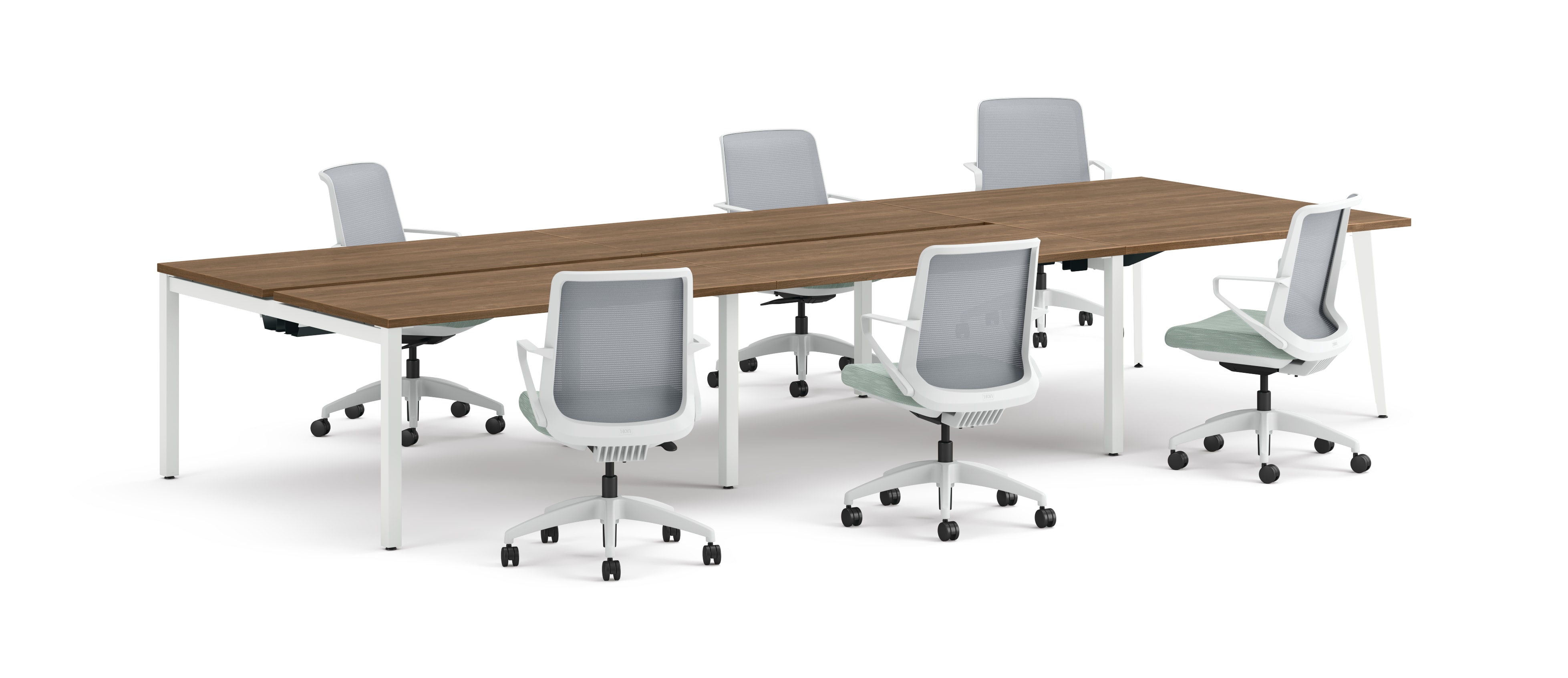 Six ergonomic office chairs arranged around two connected rectangular desks with wooden tops and white legs.