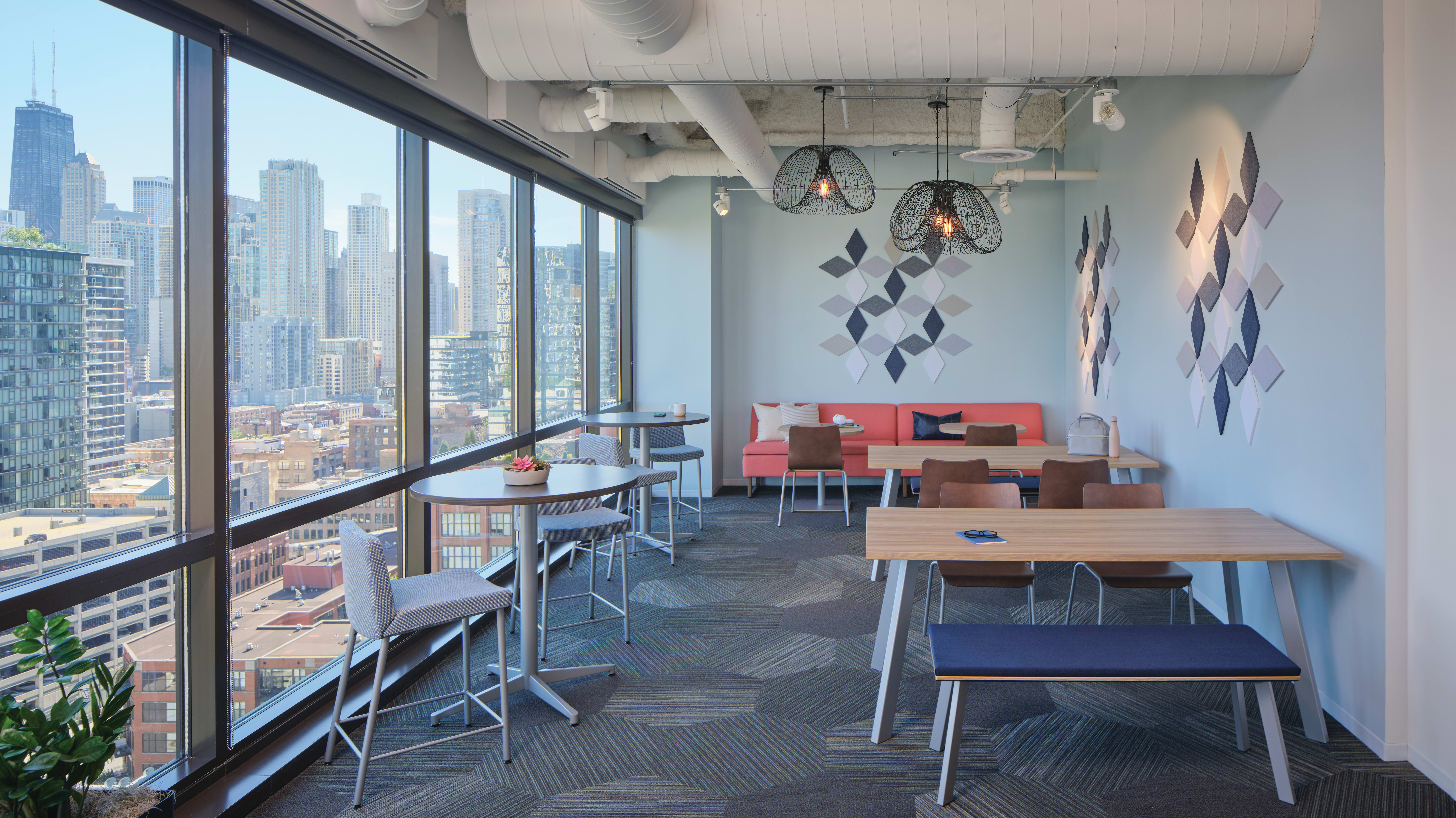 Preside café tables, Ruck Shell Chairs, Astir Two Seat Low Back, and Unika Vaev Solid Color Wall Tiles. 