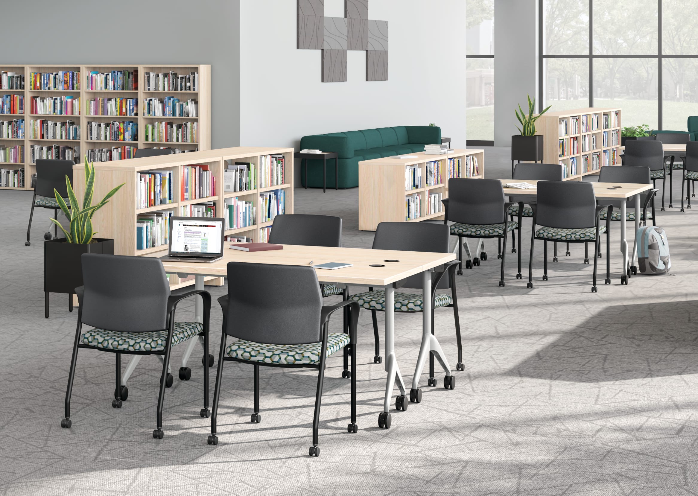 A multi-media center setting featuring SoCo seating, Ignition guest chairs, and Motivate tables.
