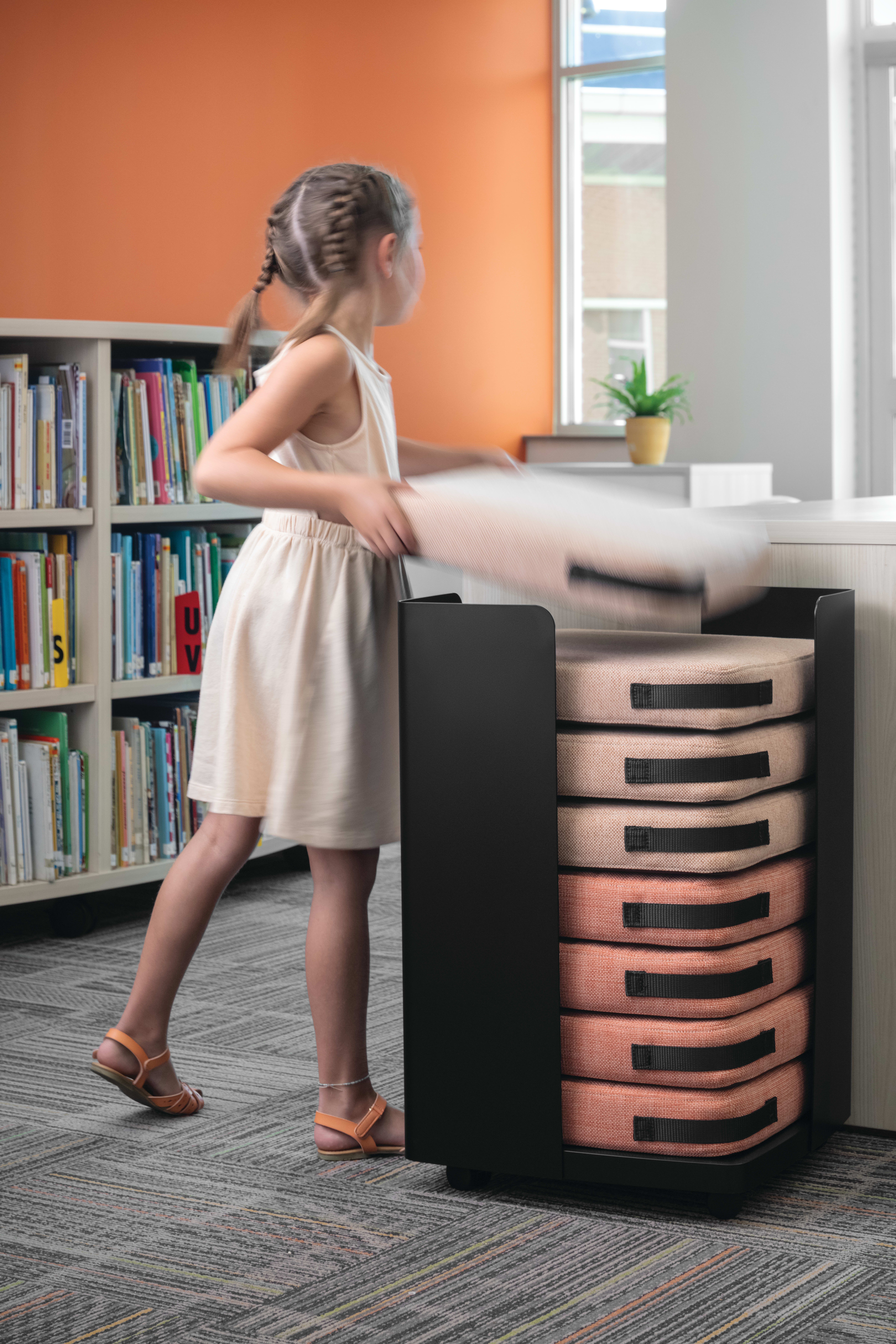Storyline Bookcases with Confetti Floor Cushions.