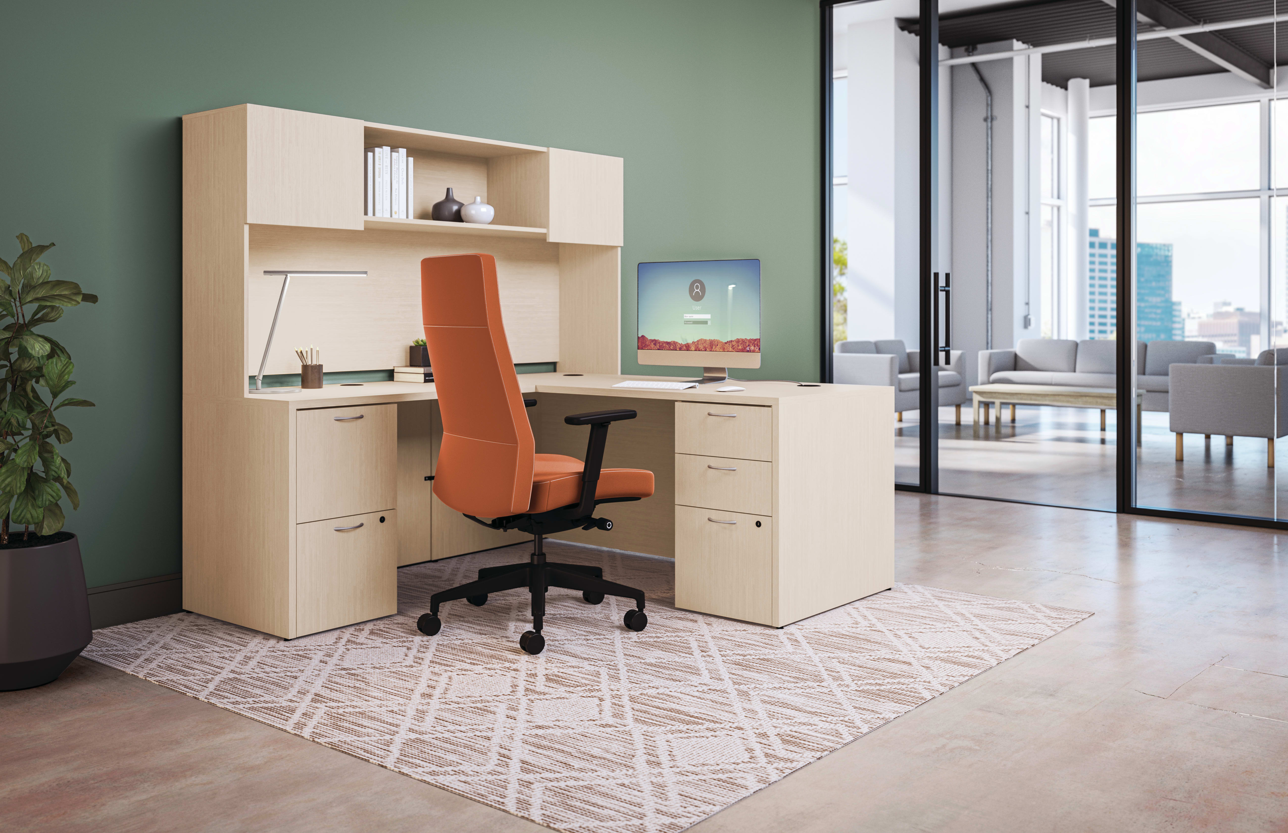 Private office featuring Mod L- shaped desk with high-back Cofi executive chair in orange fabric. 