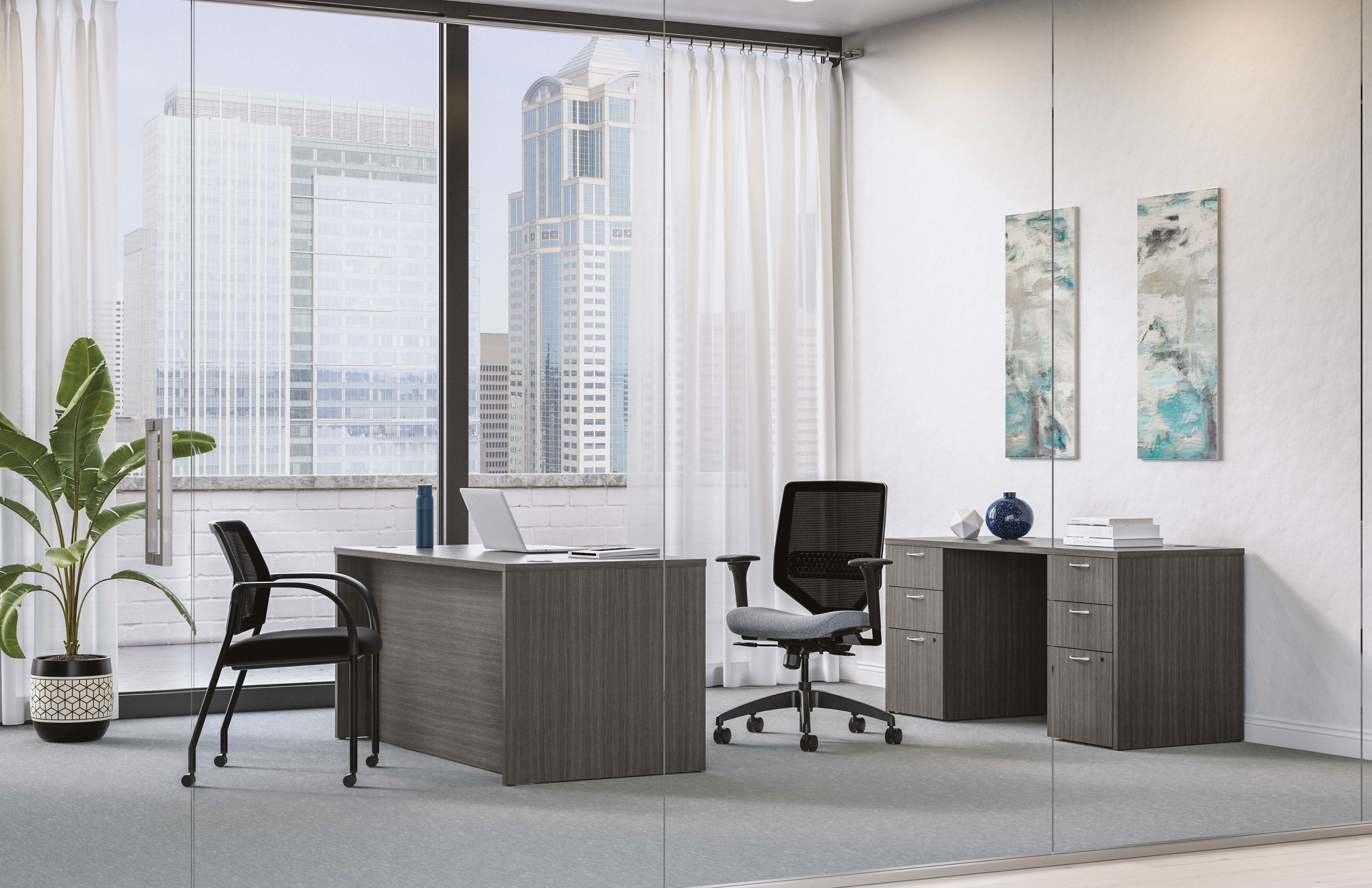 Mod executive desk in Slate Teak with Solve task chair and Ignition guest chair