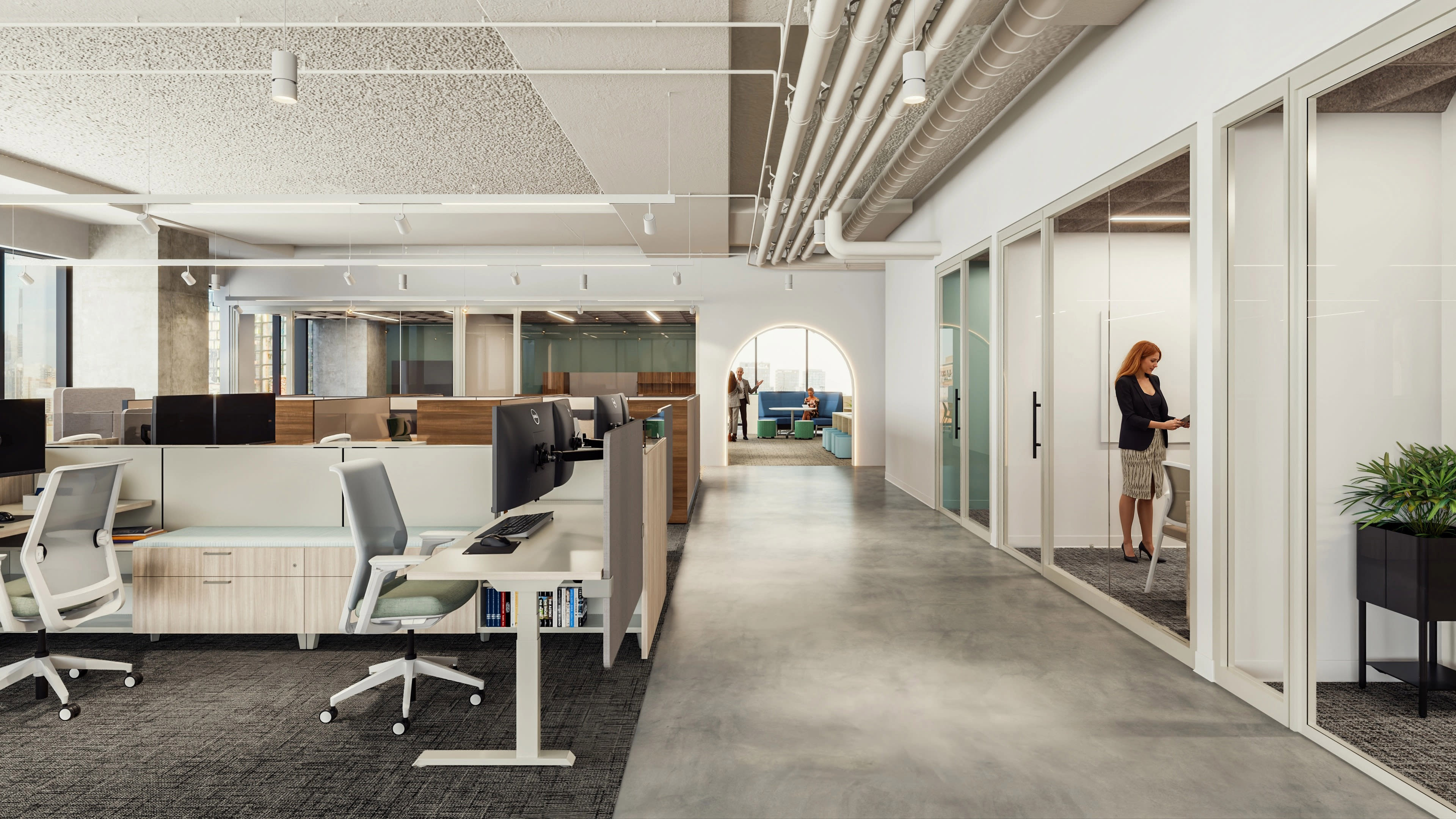 Open workstation with height-adjustable desk, privacy panel, task chair on casters, low storage cabinet, and monitor setup within benching system.