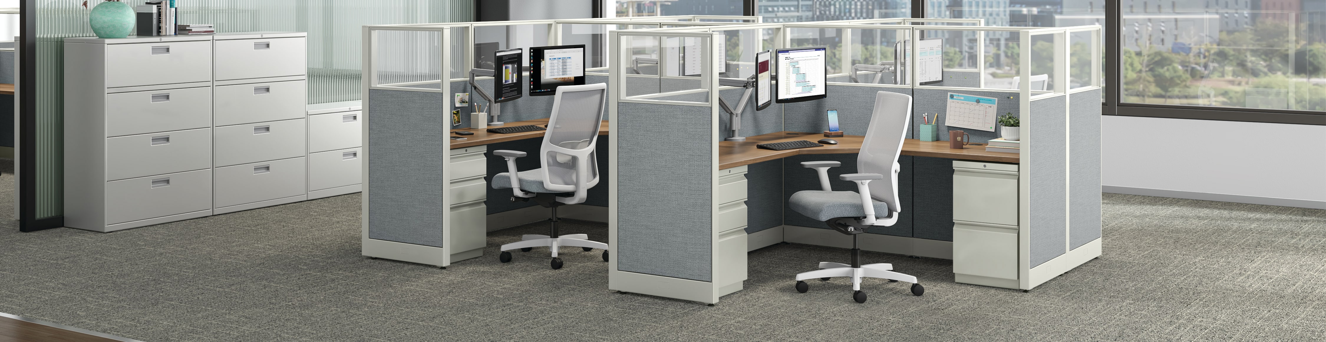 Accelerate workstations shown with Ignition task chairs and Brigade storage.
