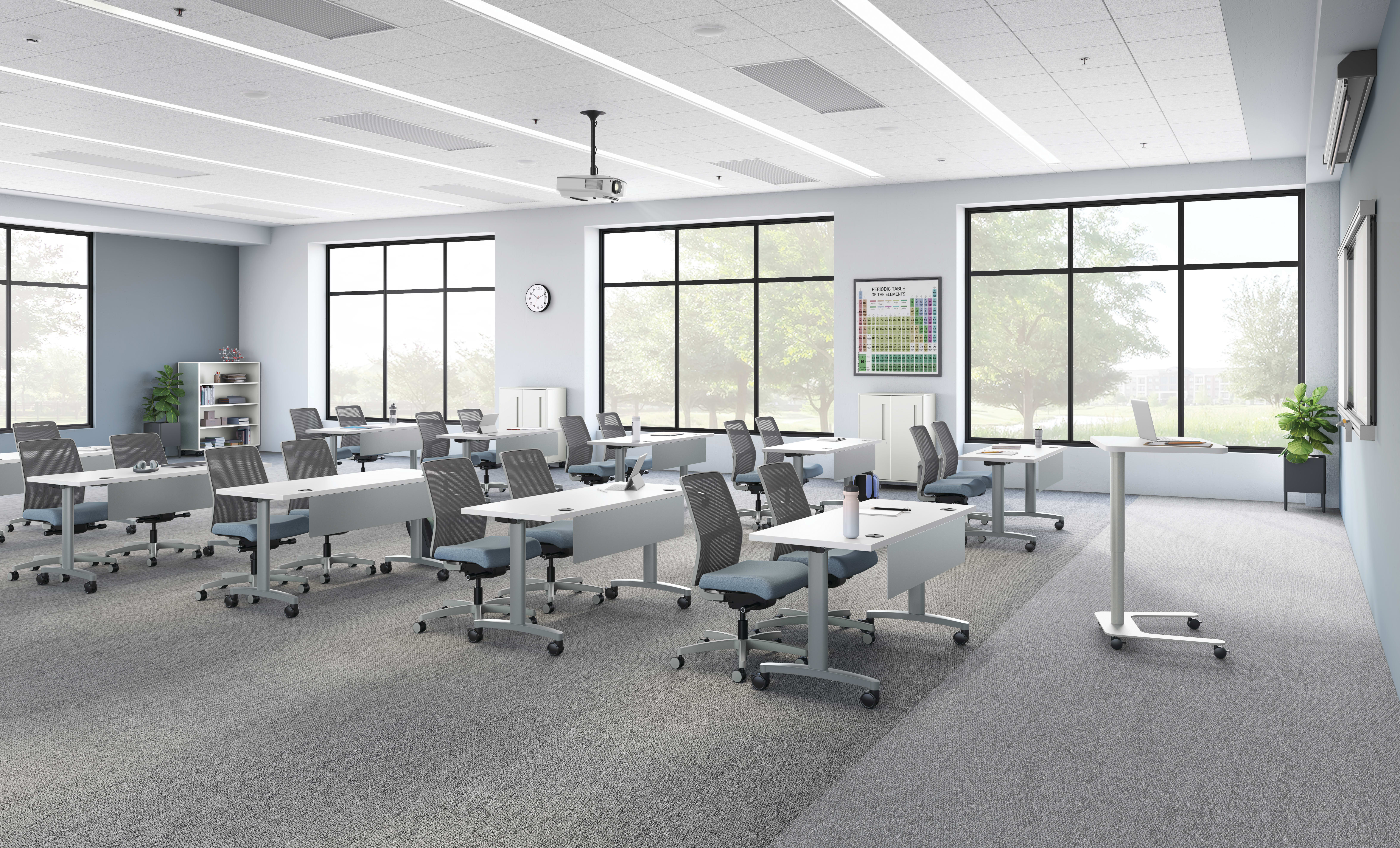 A classroom setting featuring Ignition task seating and Huddle training tables.