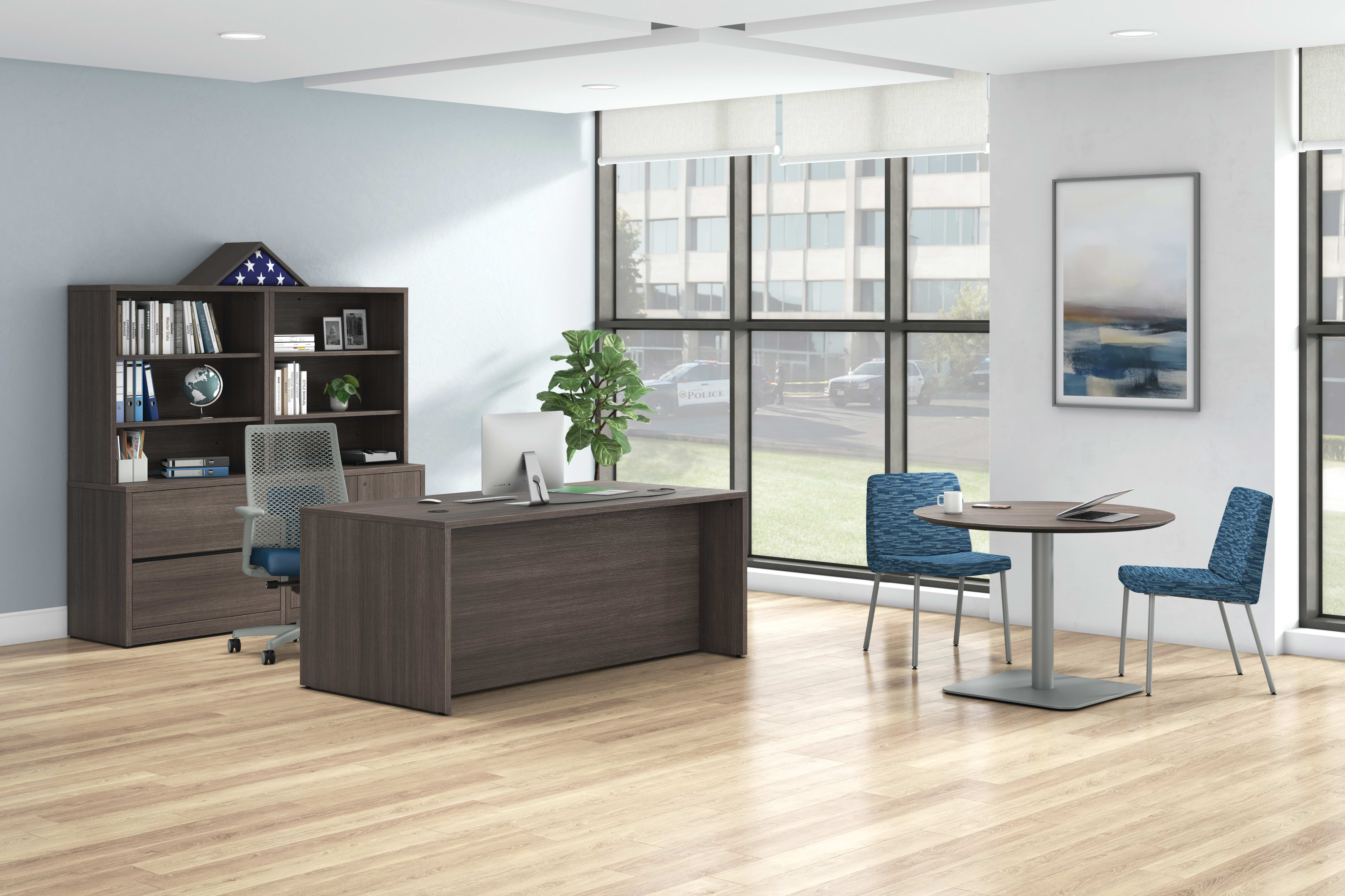A government private office setting featuring a 10500 Series desk, Flock side chairs, and a Birk table.