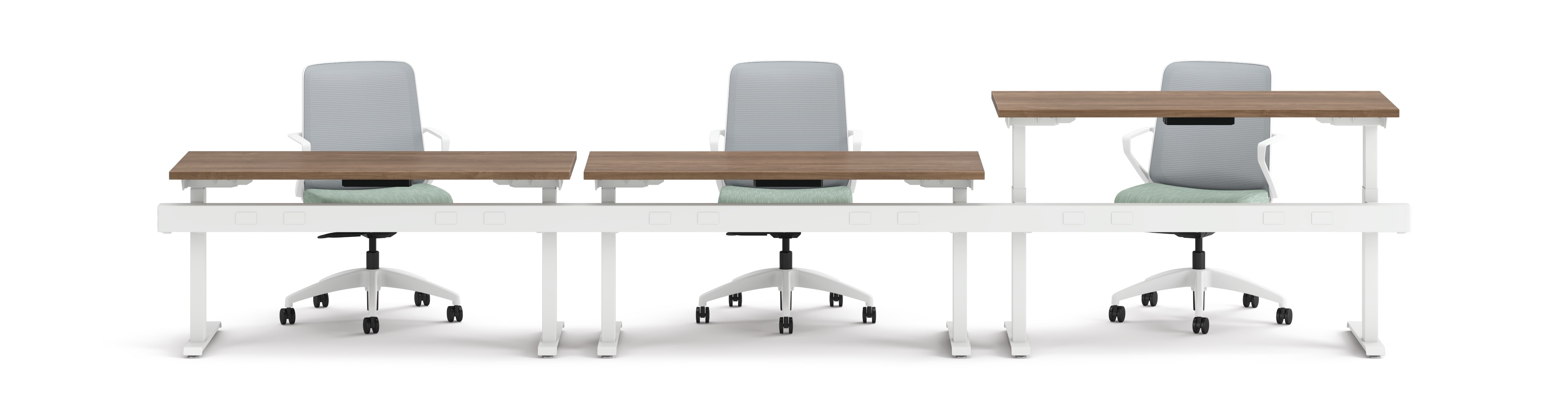 Three ergonomic office chairs positioned behind adjustable-height desks with white frames and wooden tops.