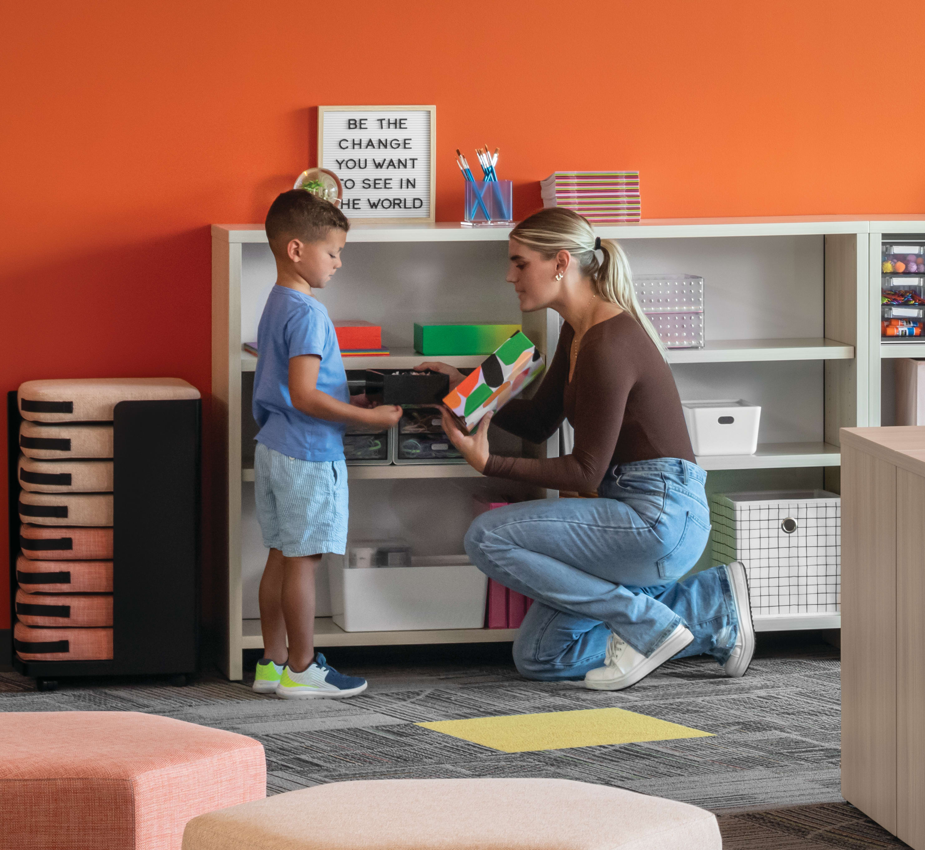 Storyline Linear Bookcases and Bistro Tables with Tangram Poufs and Flock Minis.
