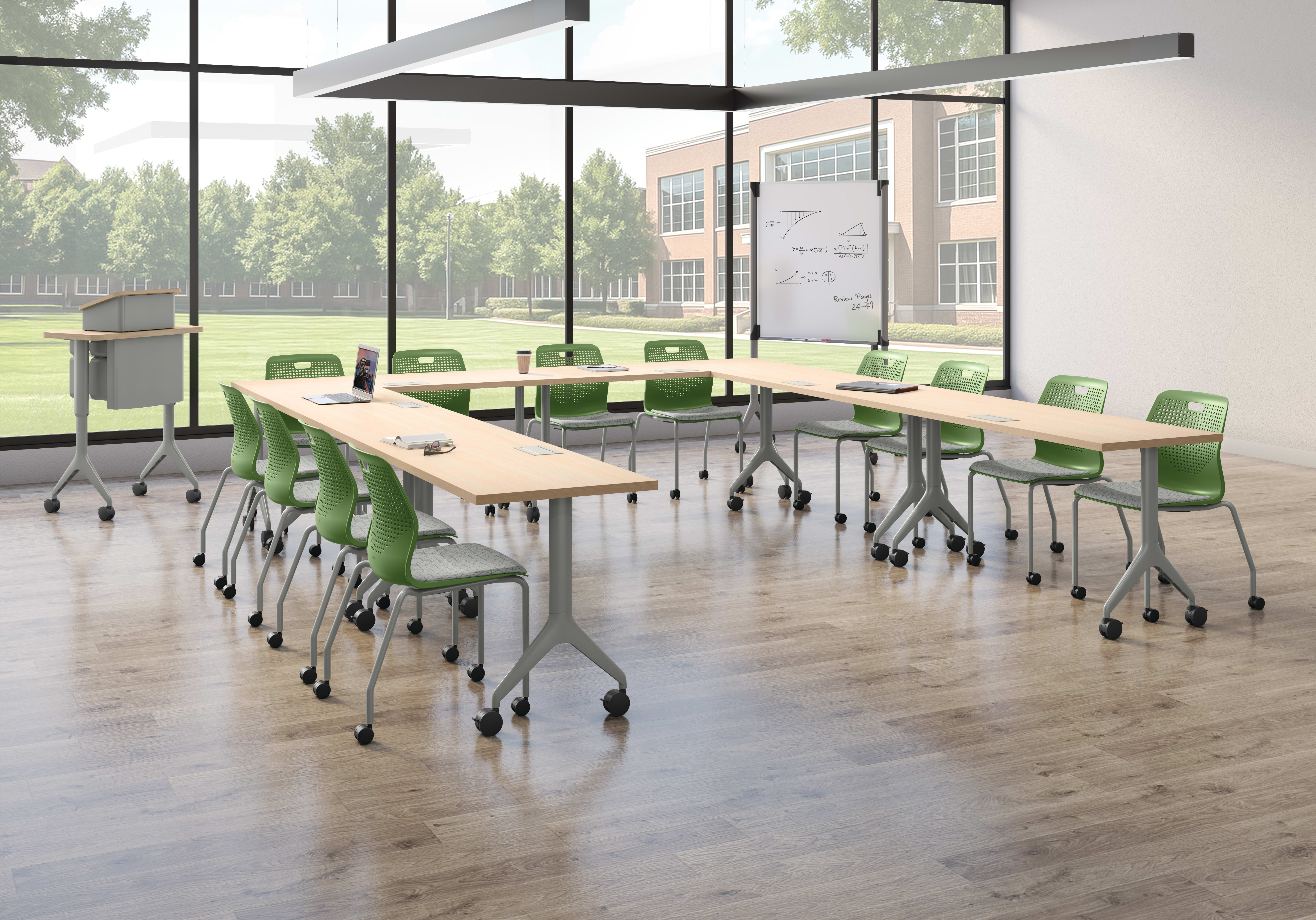Small U-shaped classroom space with green Etch chairs and Motivate tables