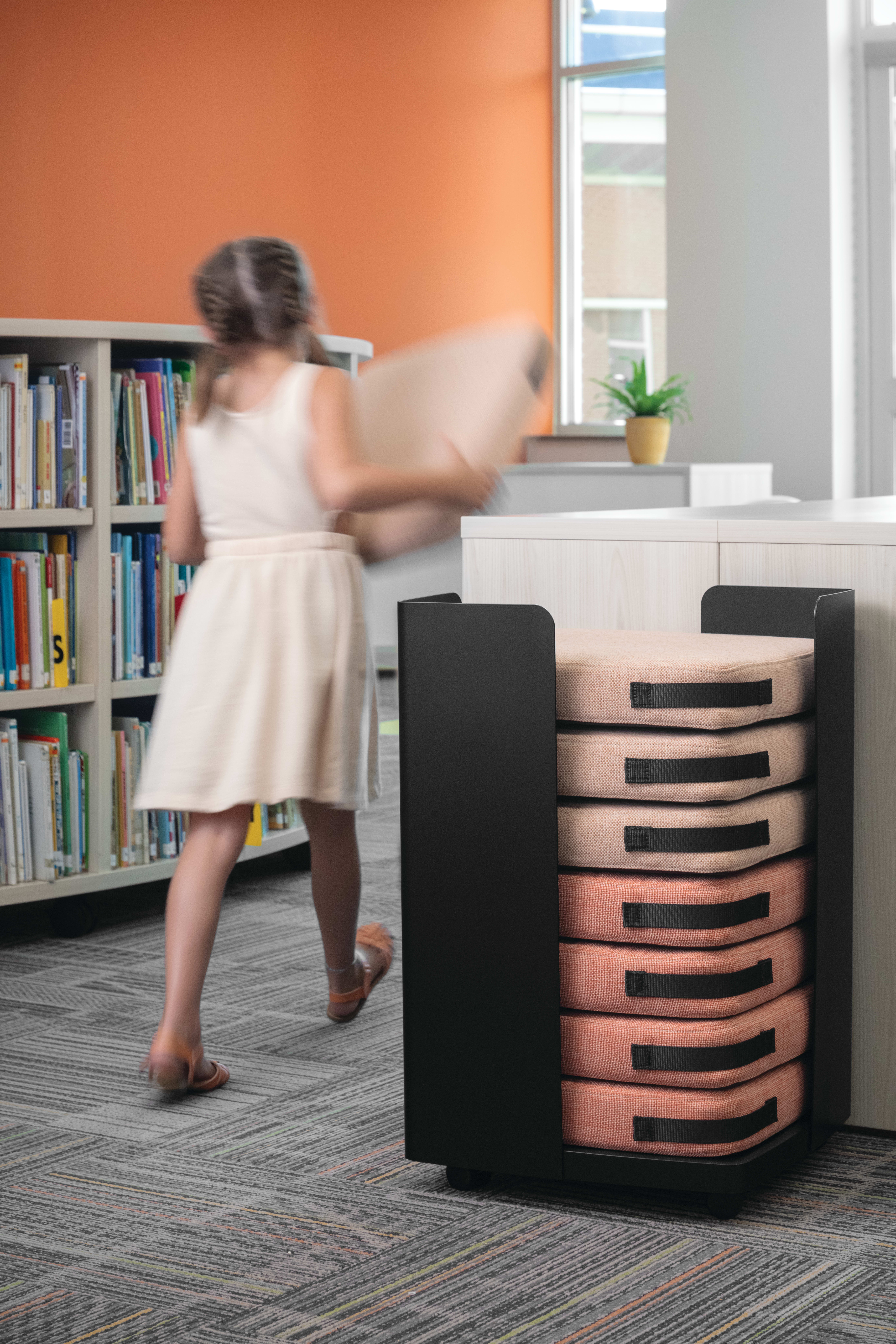 Storyline Bookcases with Confetti Floor Cushions.