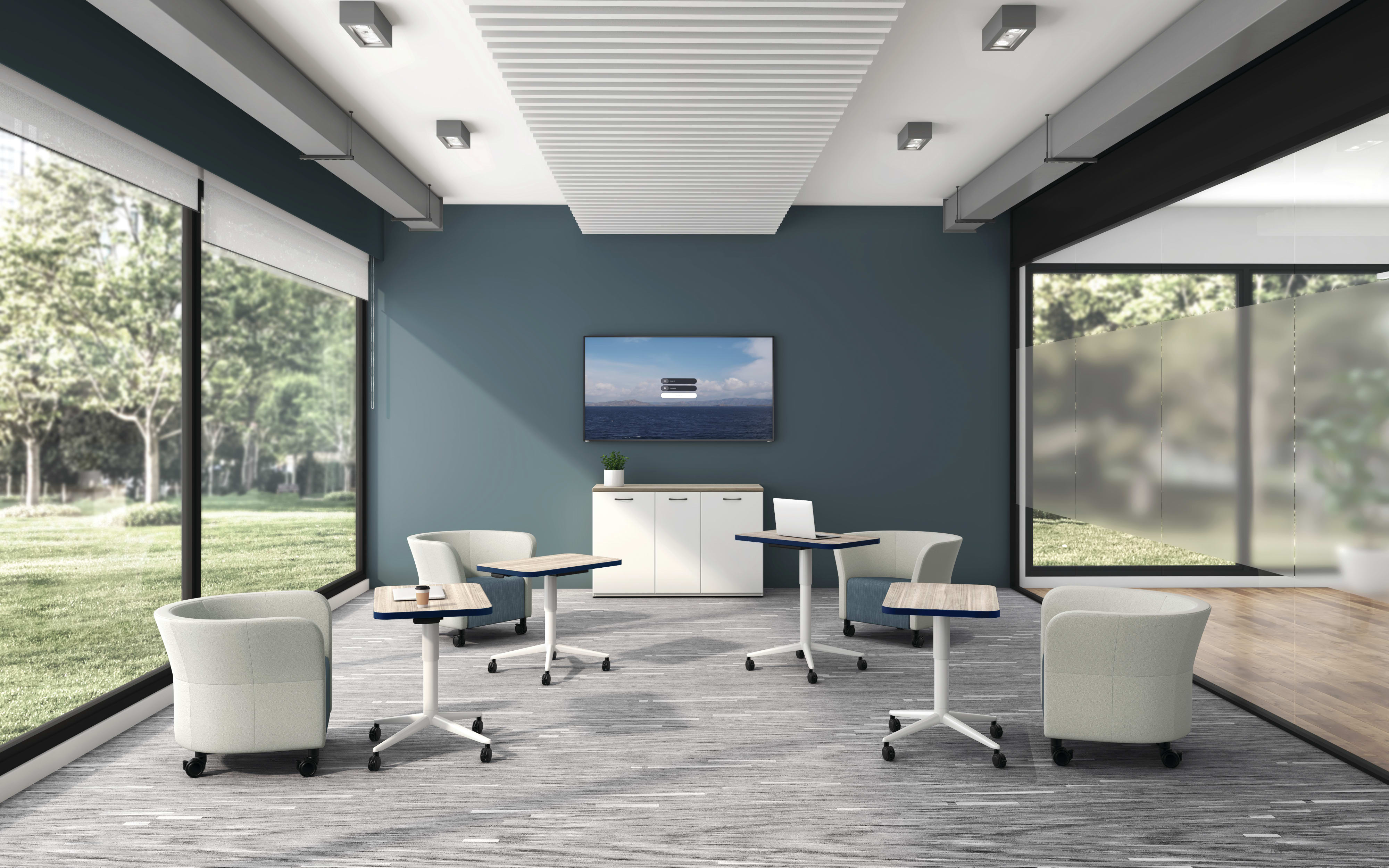 Huddle Laptop Tables with Flock Round Lounge Chairs socially distanced around a conference room.