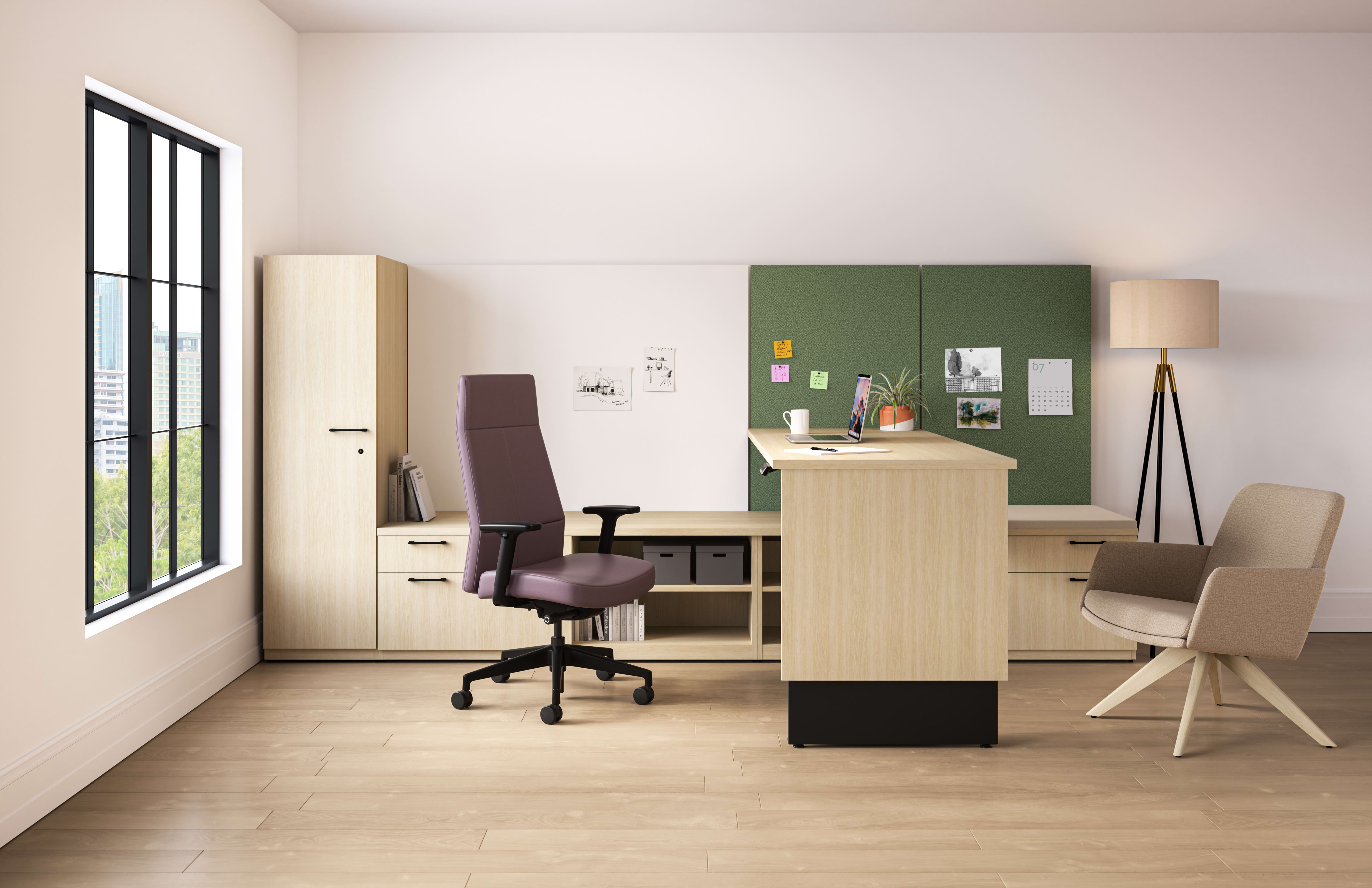 Concinnity Height-Adjustable Desk with a Cascade leg in light laminate and green panel fabric in a private office with Mav and Cofi chairs.