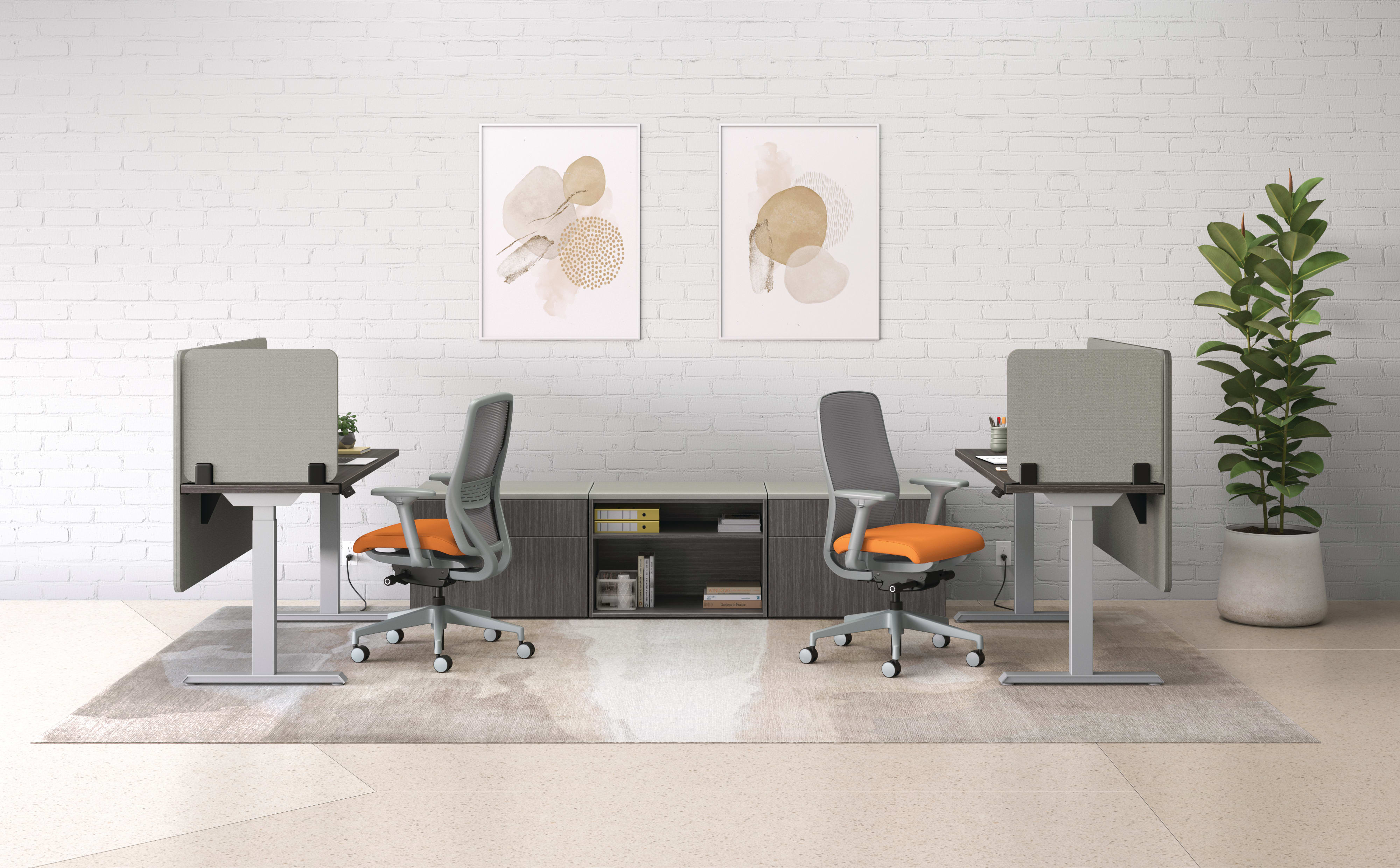 An open plan workstation arrangement with Nucleus task chairs, height-adjustable desks, and Mod storage.