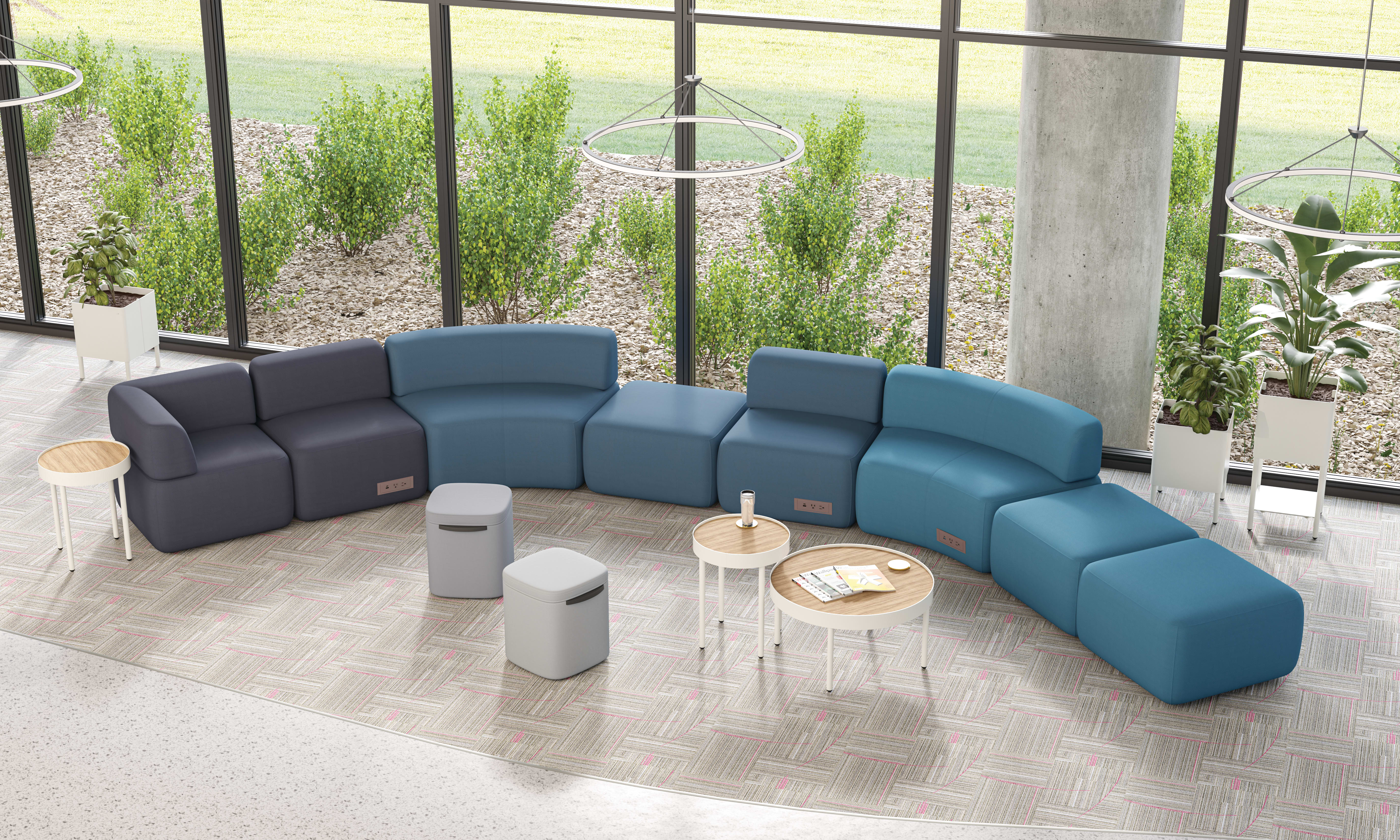 SoCo modular lounge in public space with Sculpt occasional tables & planters and Astir poufs.