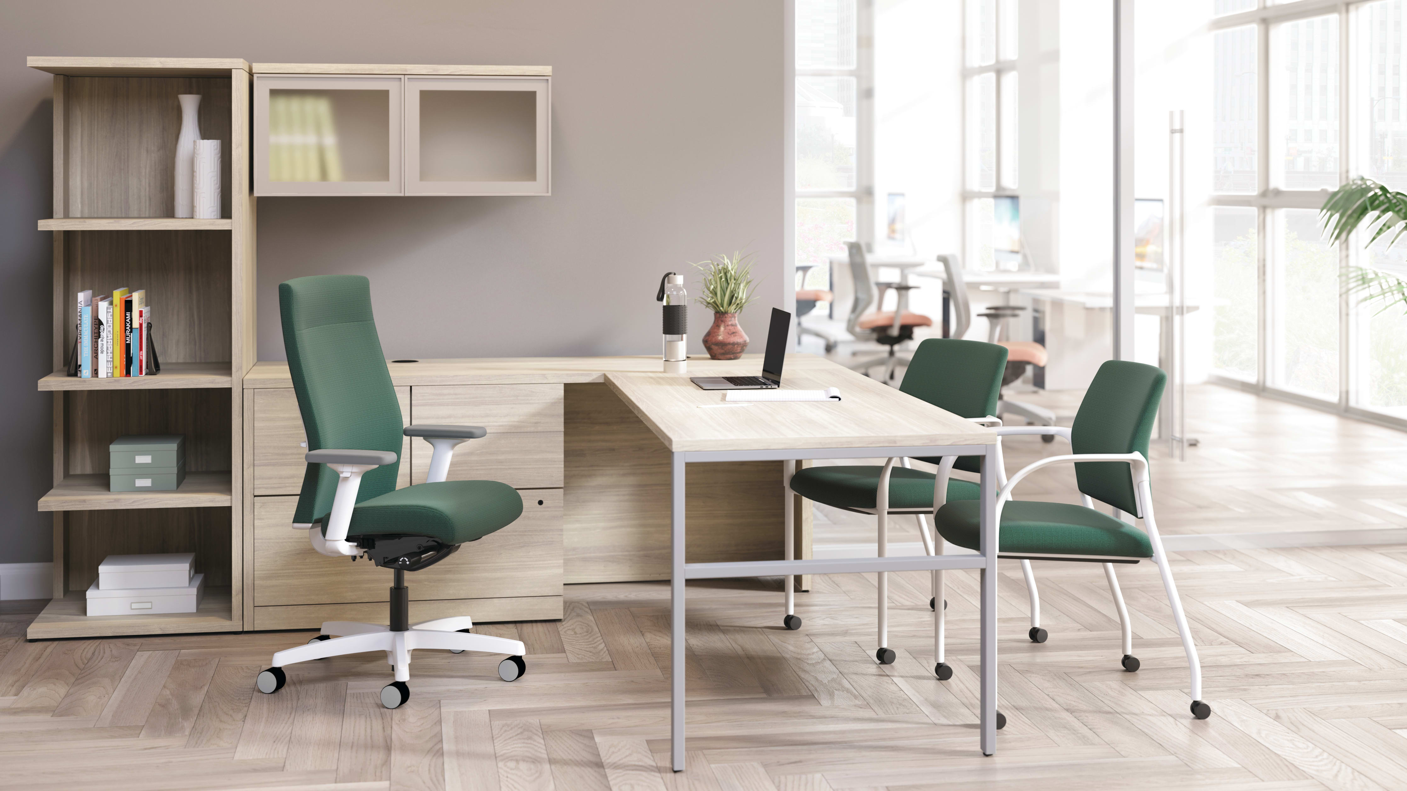 Ignition upholstered chair at 10500 Series L-shaped desk with 2 guest chairs.