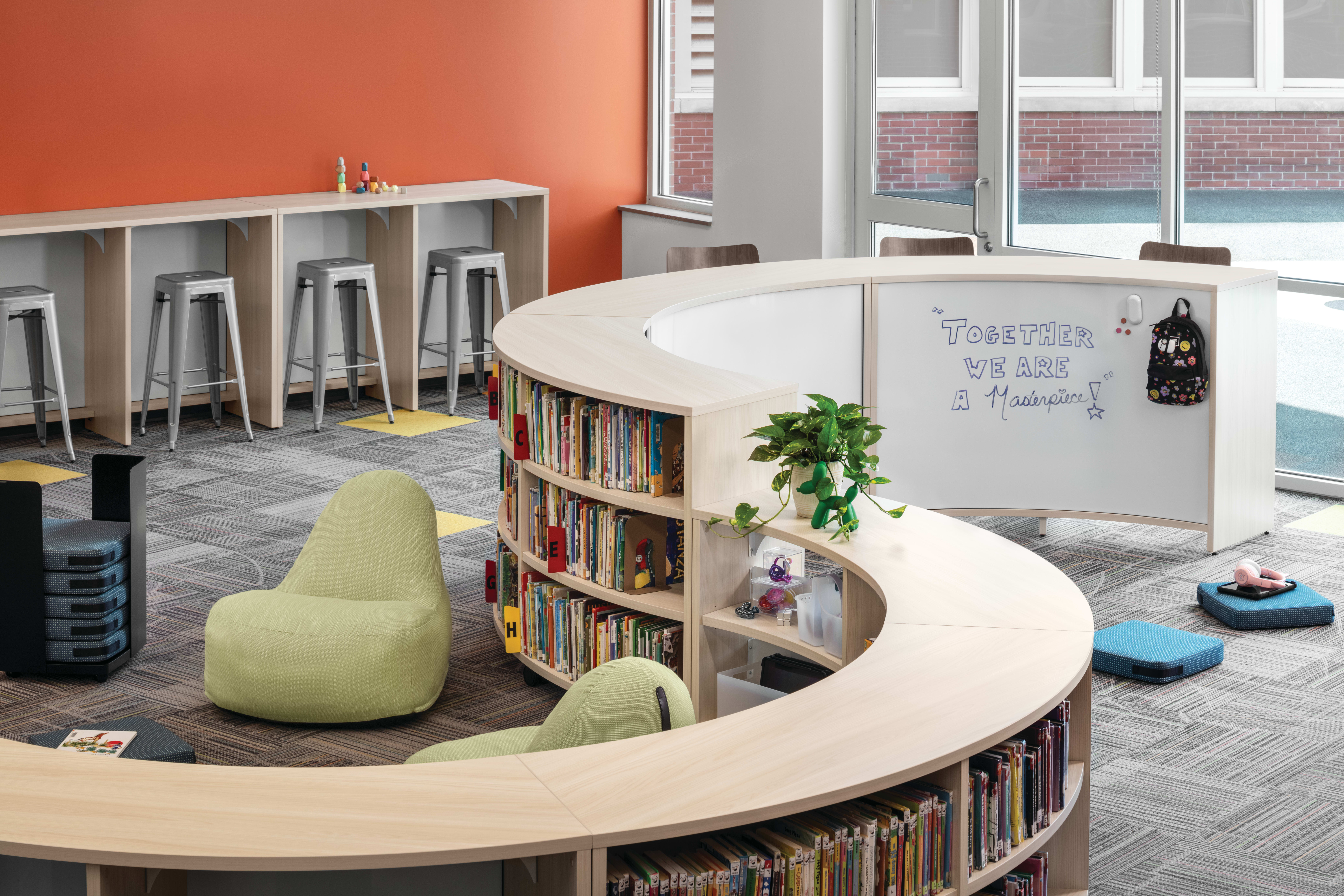 Storyline Bookcases and Bistro Tables with Confetti Floor Cushions and Lounges.