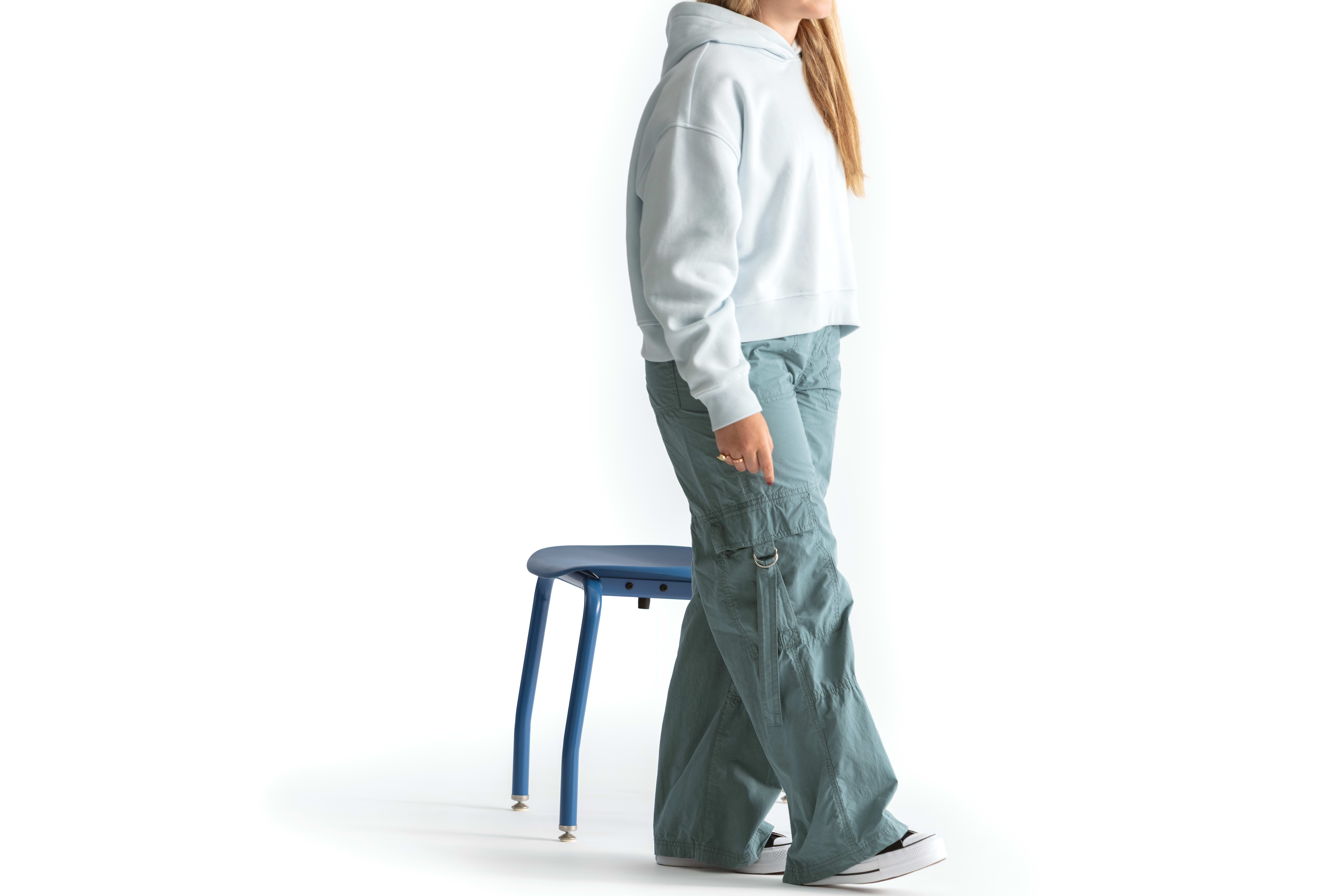 One seated student on a blue monotone Smartlink chair. One seated student on a blue monotone Smartlink chair. One seated student on a blue monotone Smartlink chair. One seated student on a blue monotone Smartlink chair. One seated student on a blue monoto