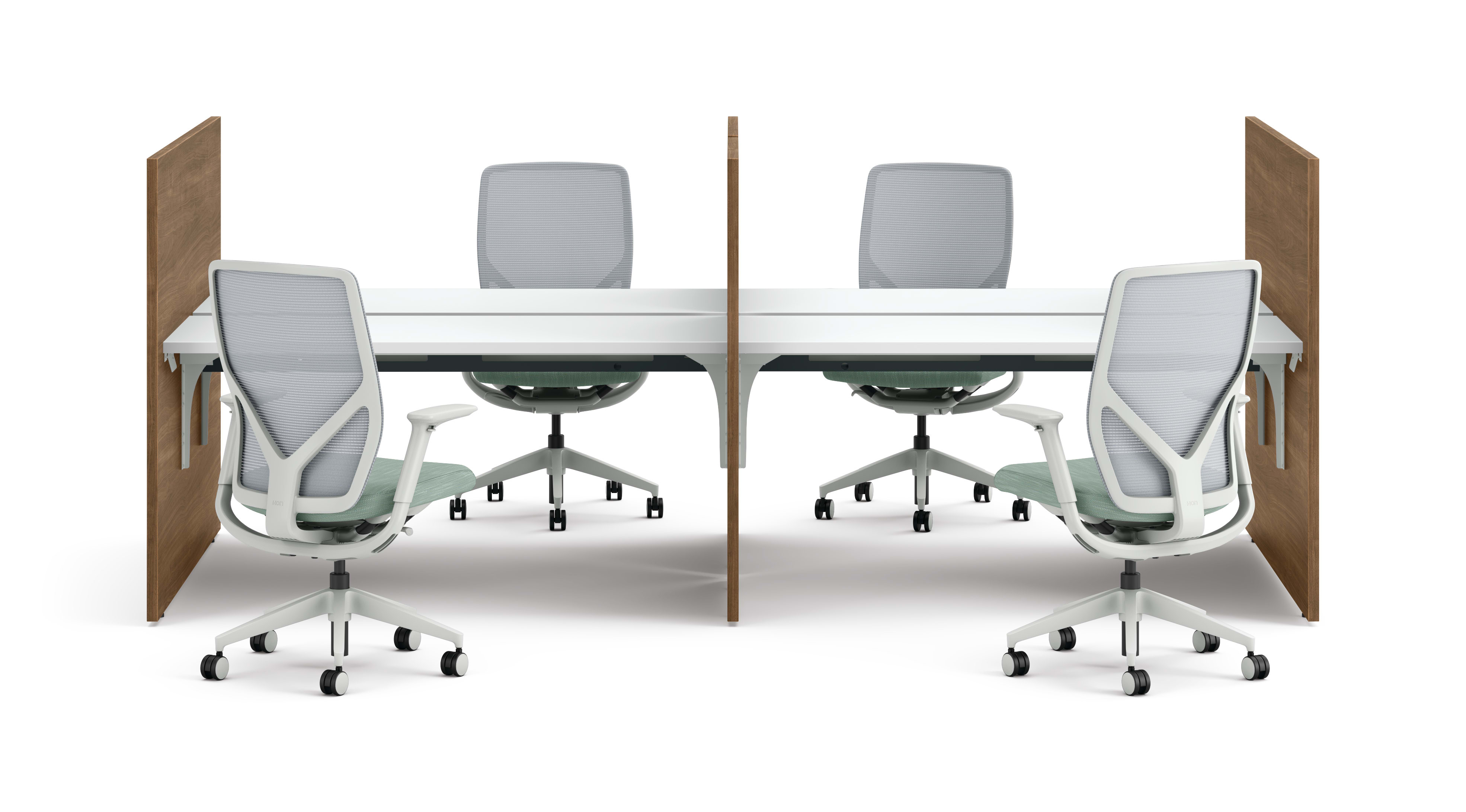 Two workstations with green fabric privacy panels, white desks, and ergonomic office chairs framed by wooden side panels.