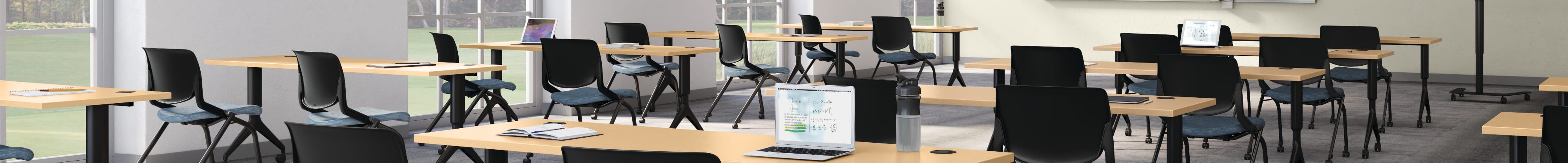 A classroom setting featuring Motivate chairs and tables with SmartLink learning board system.