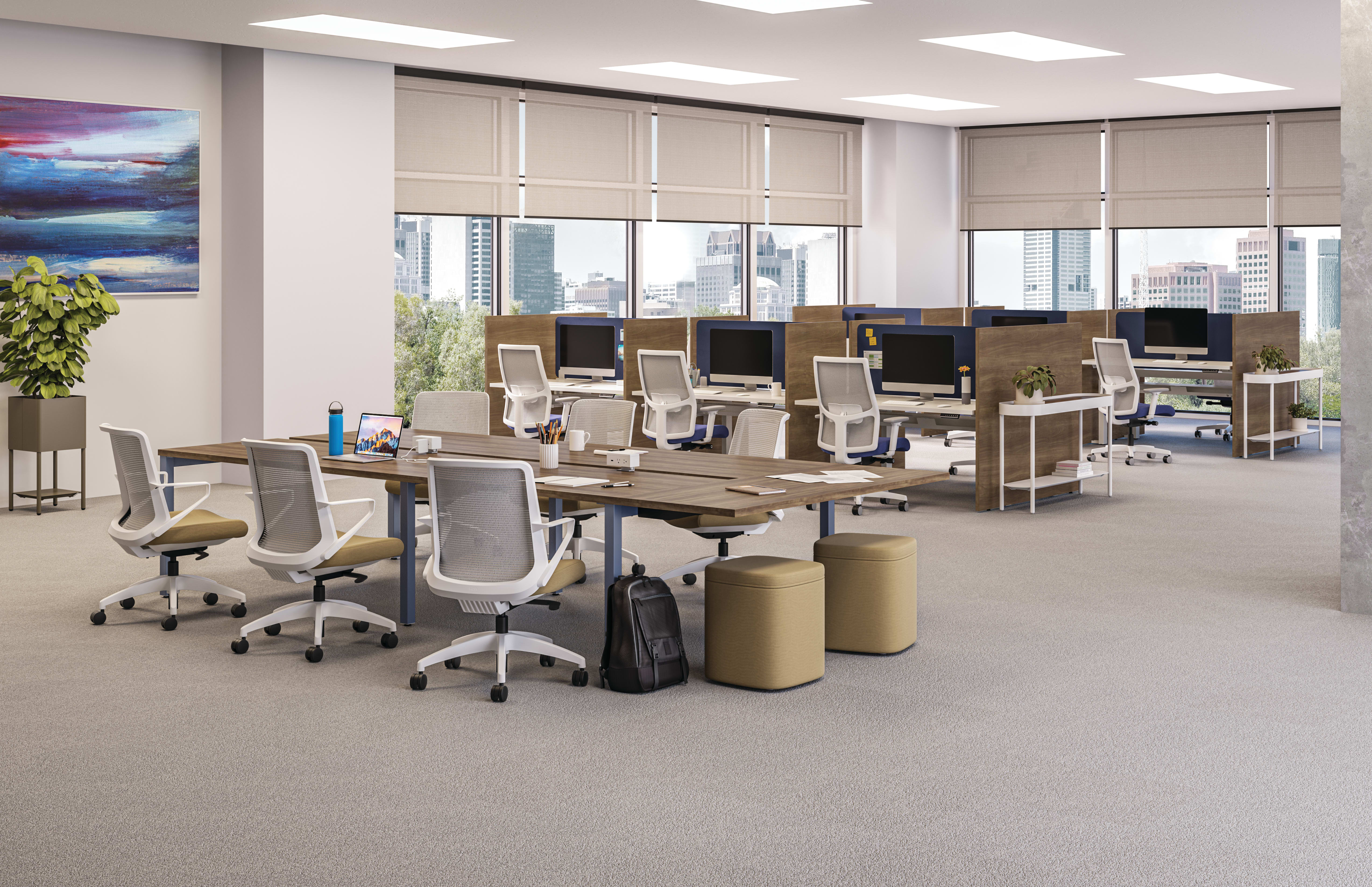 A modern and well-equipped office space with rows of desks, chairs, and computer equipment, set against a backdrop of large windows overlooking a cityscape.