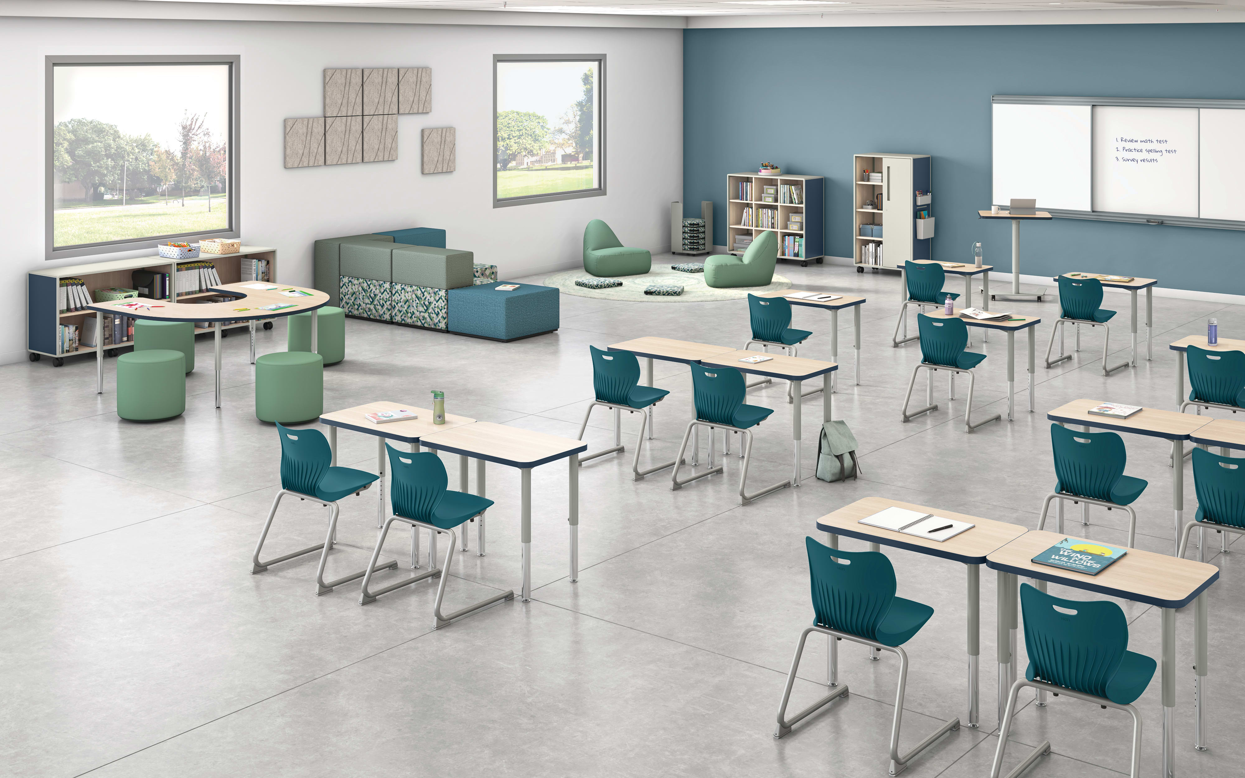Classroom with flexible Build student desks, blue student chairs, and green soft seating.