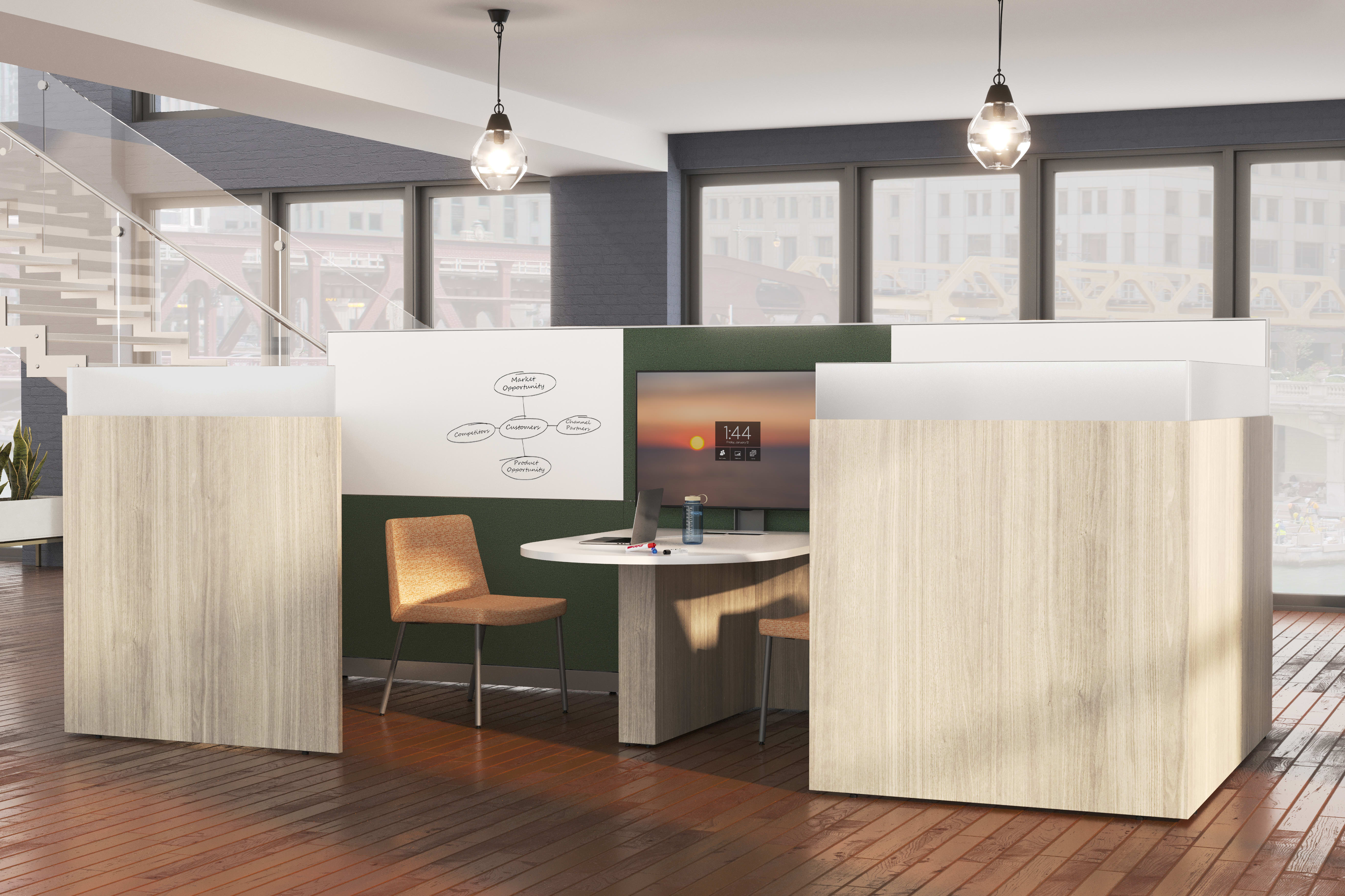 A modern and minimalist office space with wooden floors, white walls, and pendant lighting fixtures, featuring a green and white reception desk and a comfortable-looking chair.