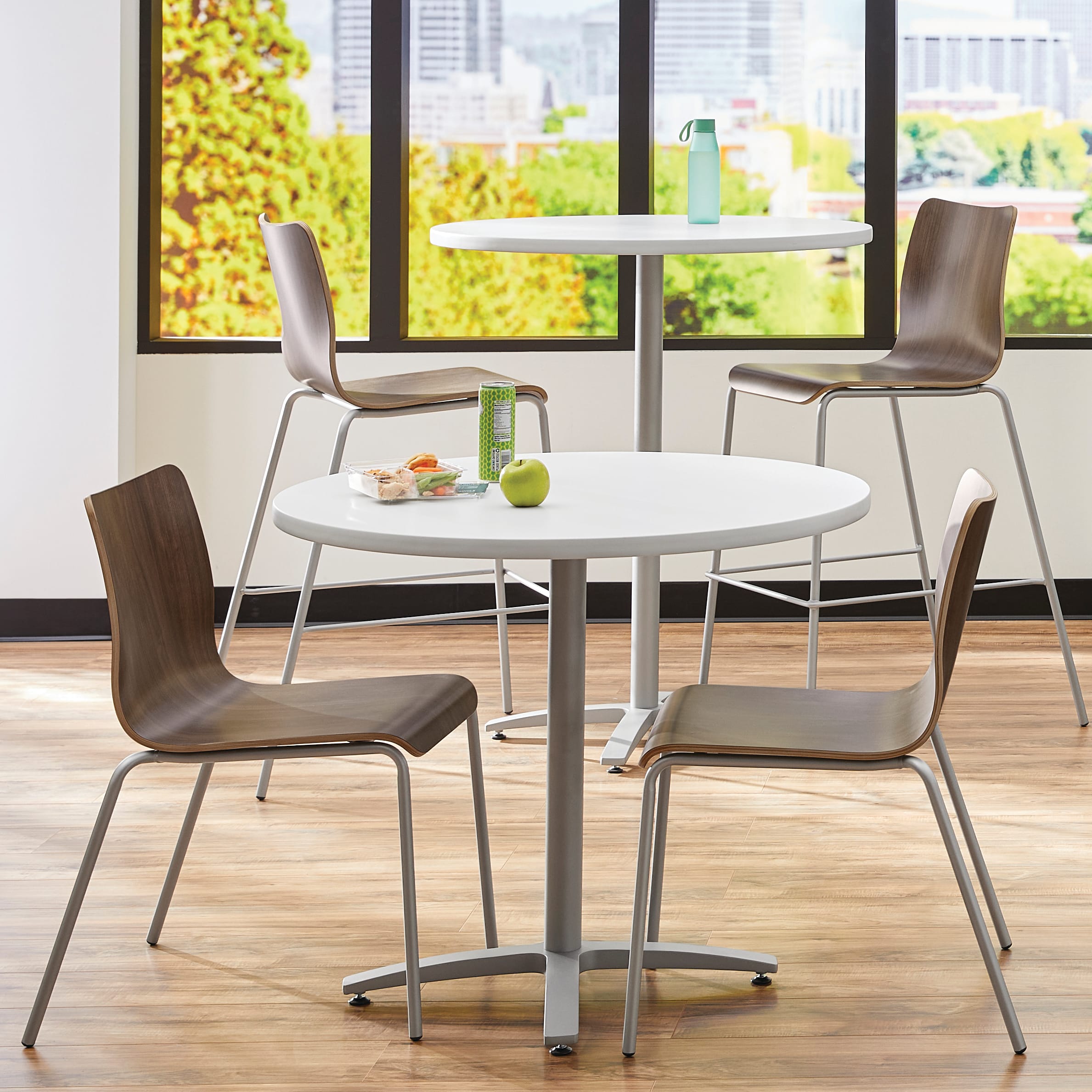 Between Standing and seated height tables with Ruck chairs in a café area