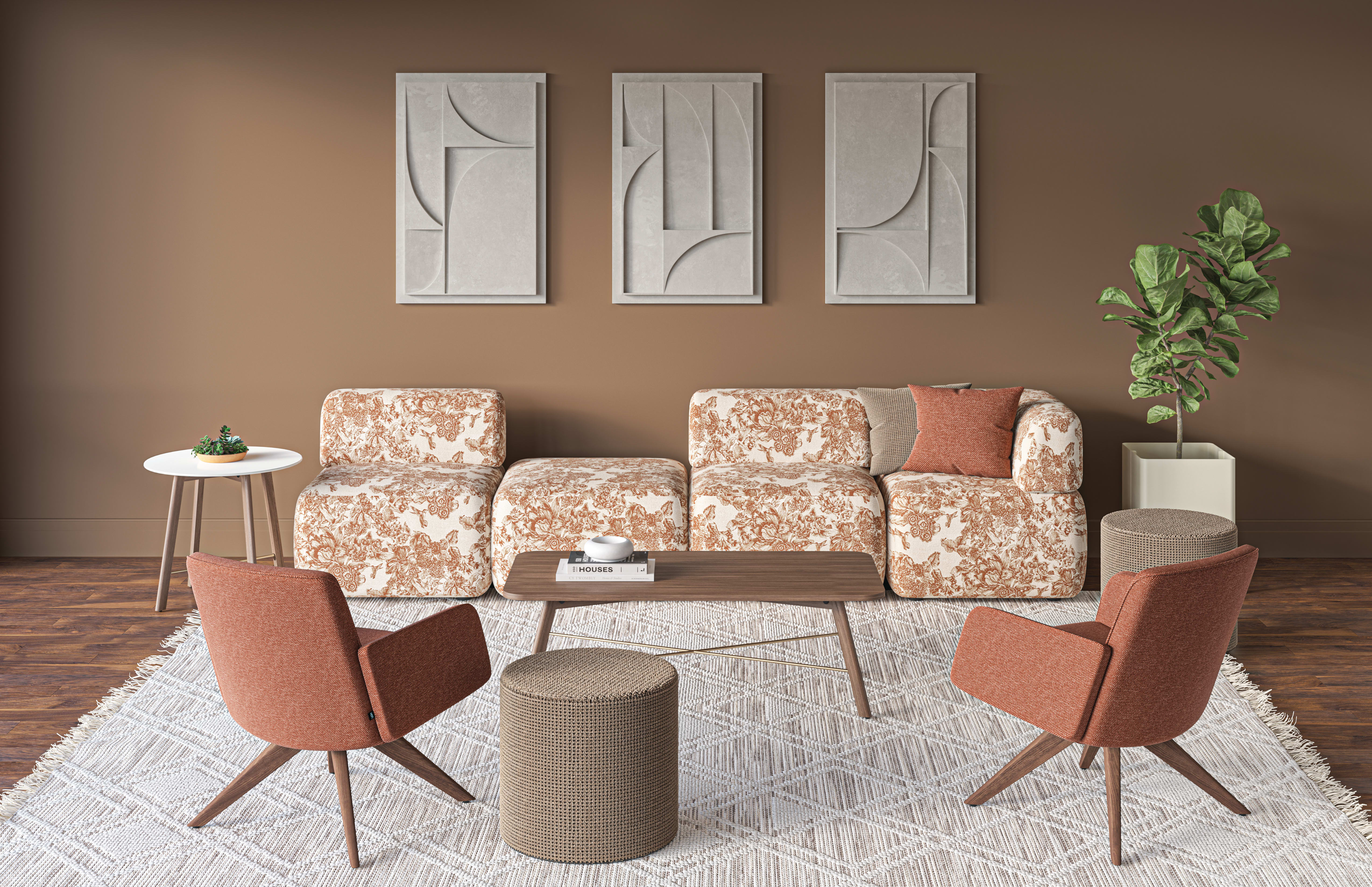 Contemporary lounge seating area with patterned sofas, upholstered lounge chairs, a low wood coffee table, and a textured area rug, styled against a warm brown accent wall with framed abstract wall art and a potted plant.