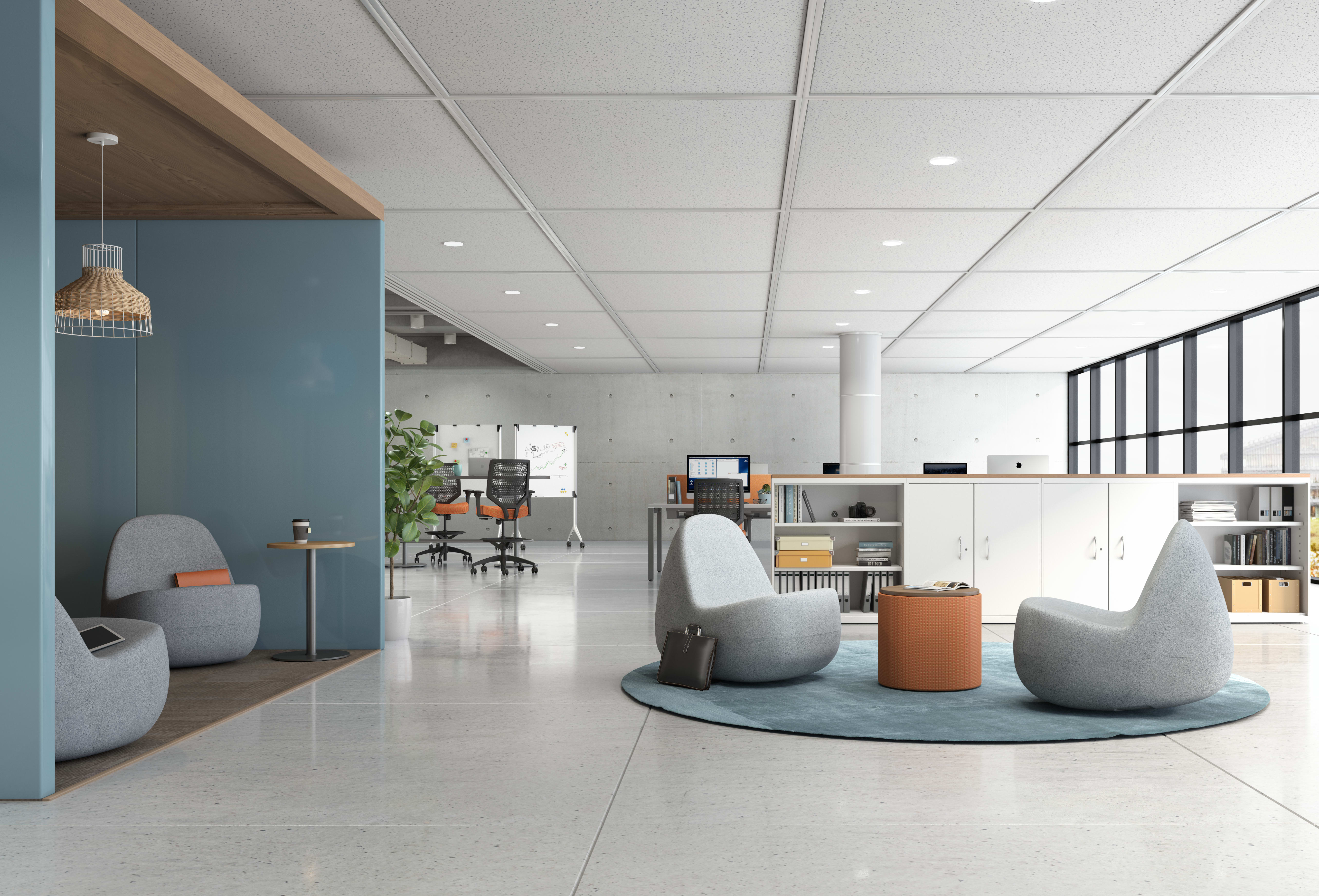 A modern and minimalist office space with comfortable seating areas, workstations, and a clean, organized layout.