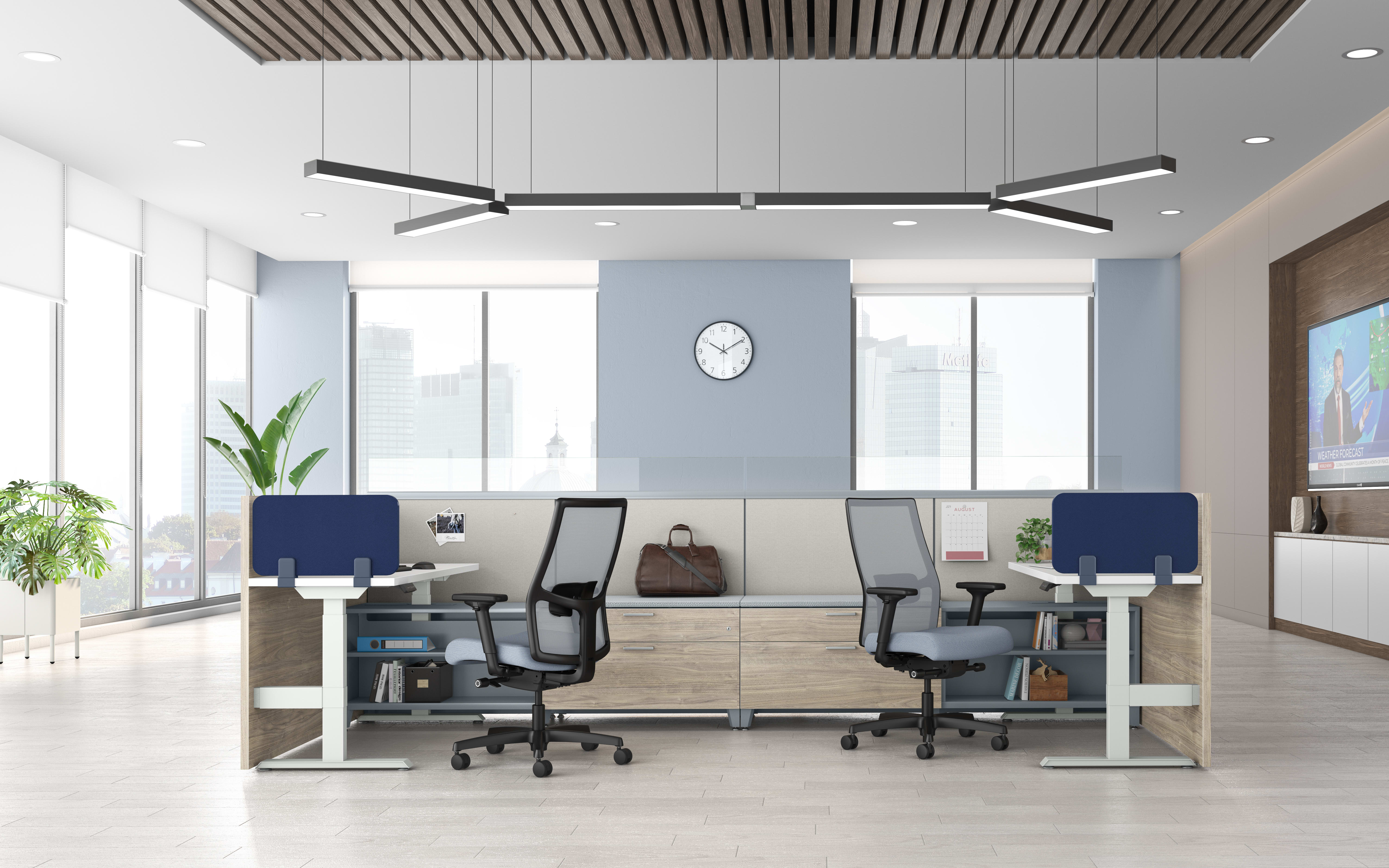 A modern and minimalist office space with sleek furniture, large windows, and a minimalist lighting fixture overhead.