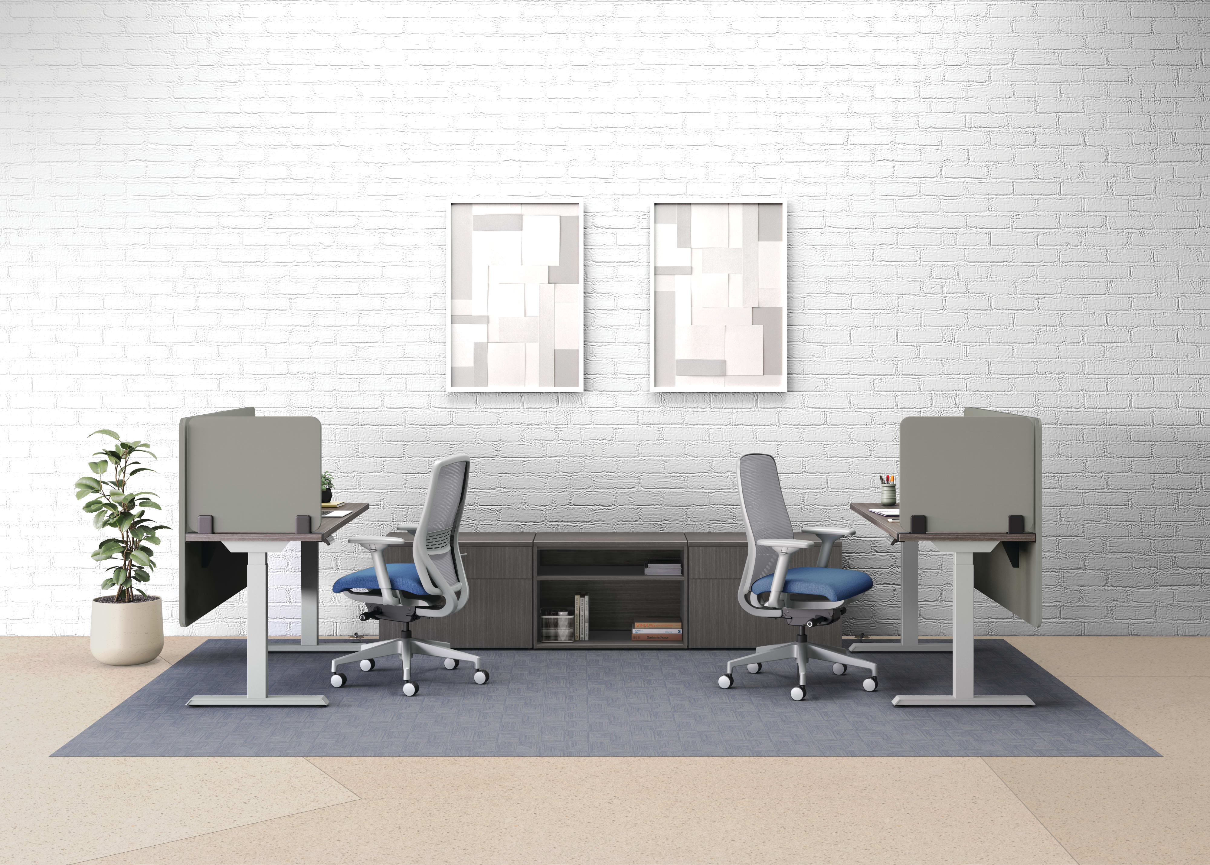 An open plan workstation arrangement with Nucleus task chairs, height-adjustable desks, and Mod storage.
