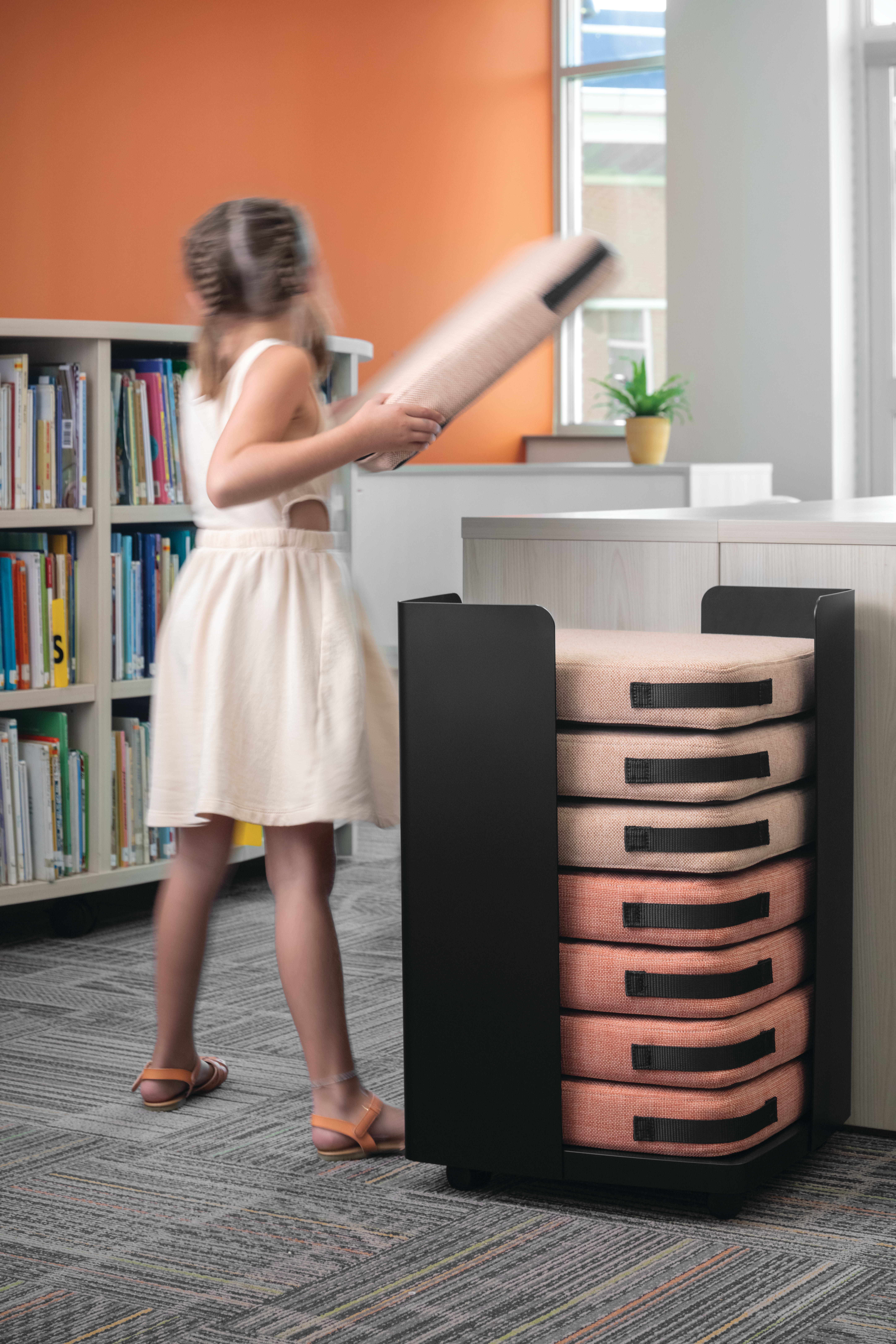 Storyline Bookcases with Confetti Floor Cushions.