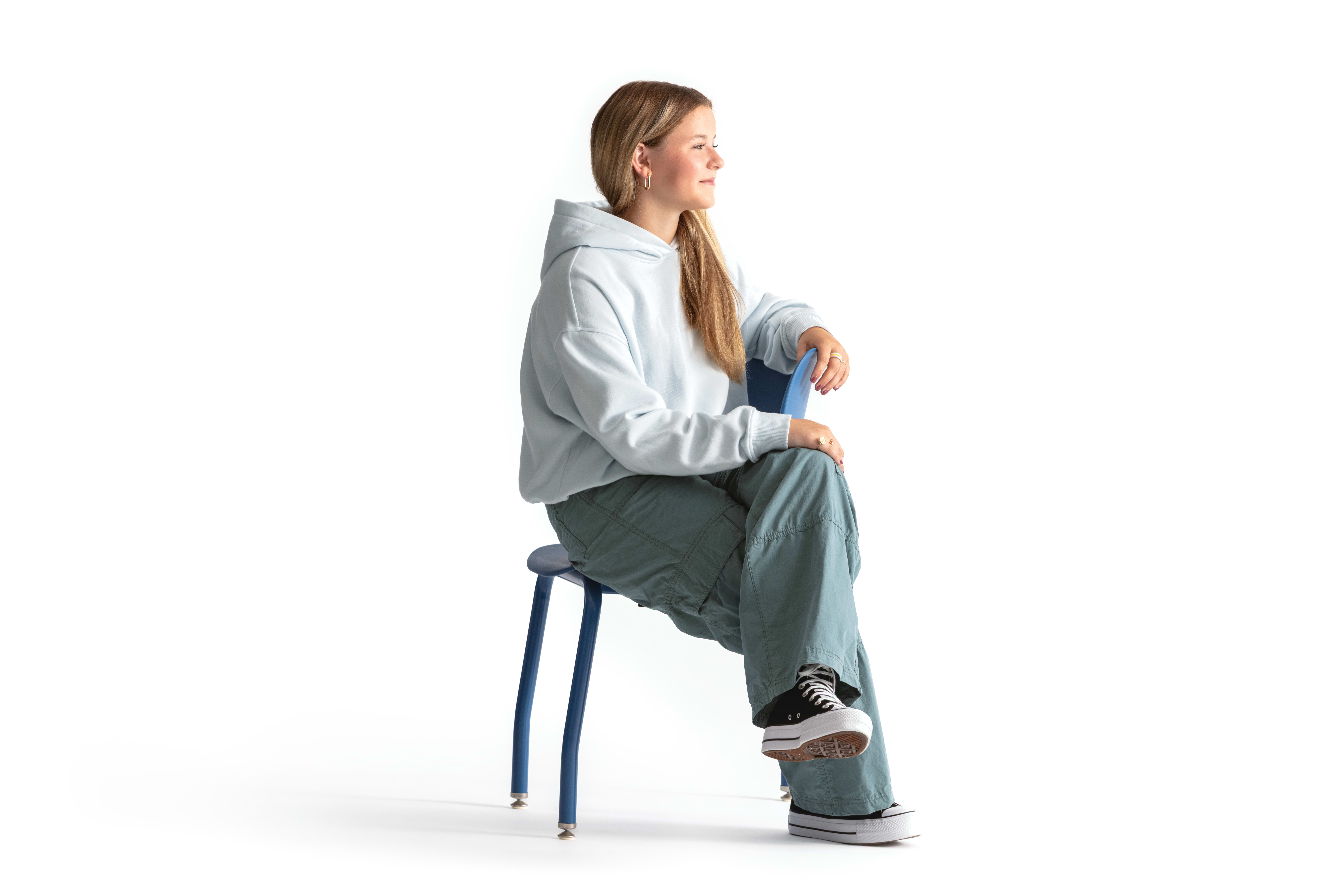 One seated student on a blue monotone Smartlink chair. One seated student on a blue monotone Smartlink chair. One seated student on a blue monotone Smartlink chair. One seated student on a blue monotone Smartlink chair. One seated student on a blue monoto