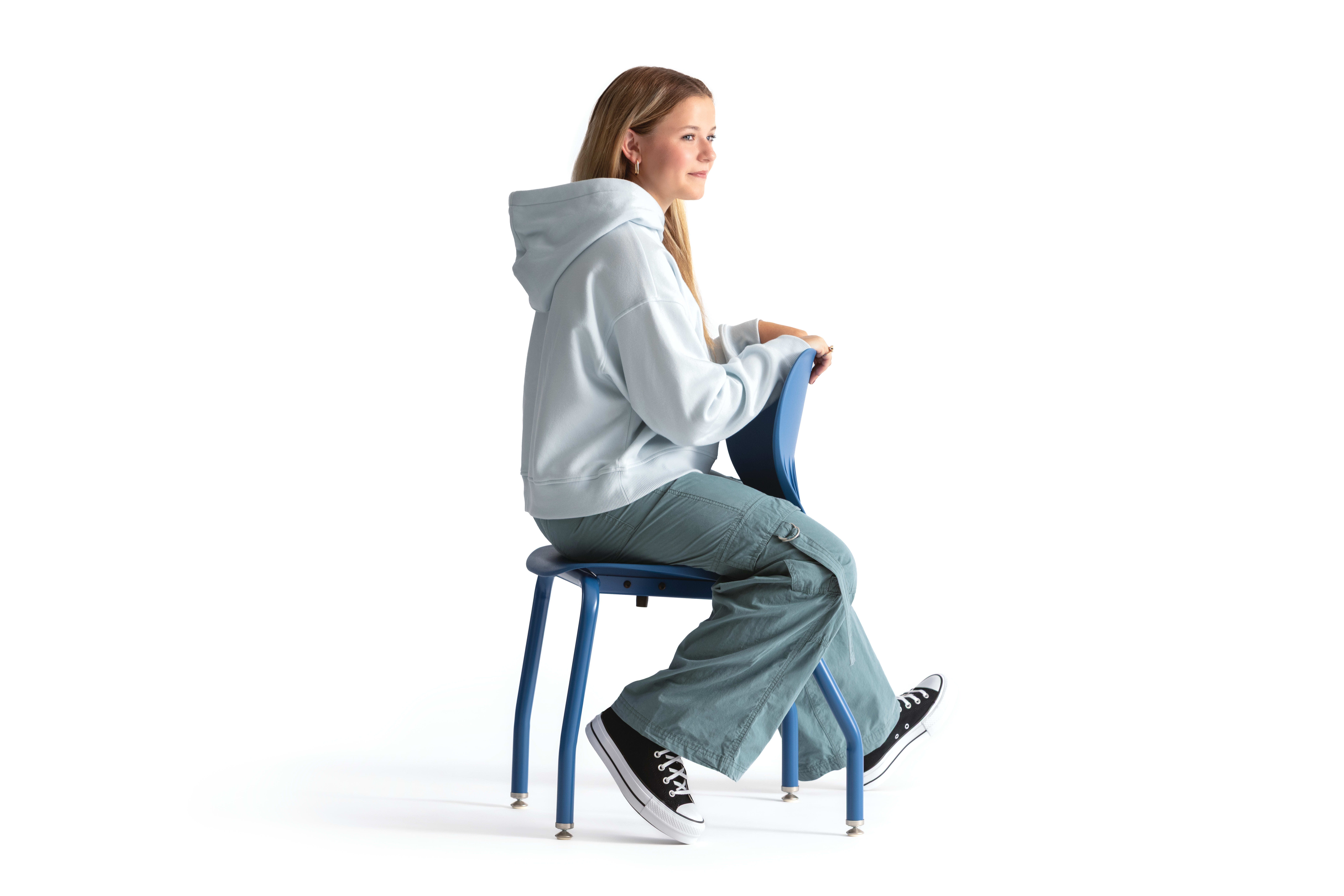 One seated student on a blue monotone Smartlink chair. One seated student on a blue monotone Smartlink chair. One seated student on a blue monotone Smartlink chair. One seated student on a blue monotone Smartlink chair. One seated student on a blue monoto
